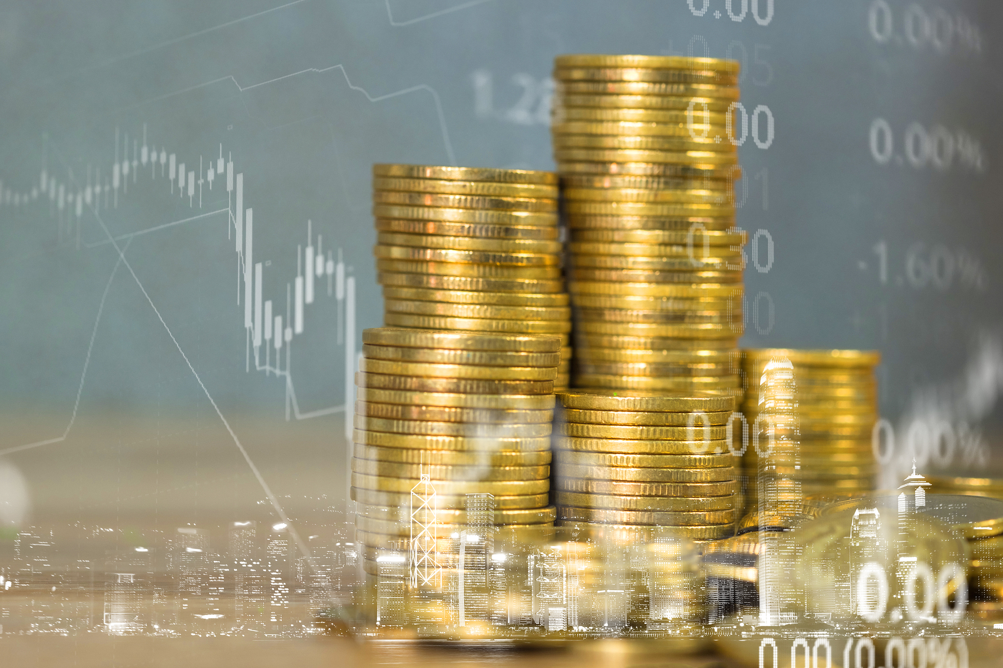 double exposure of coin stack with stock market screen chart boa