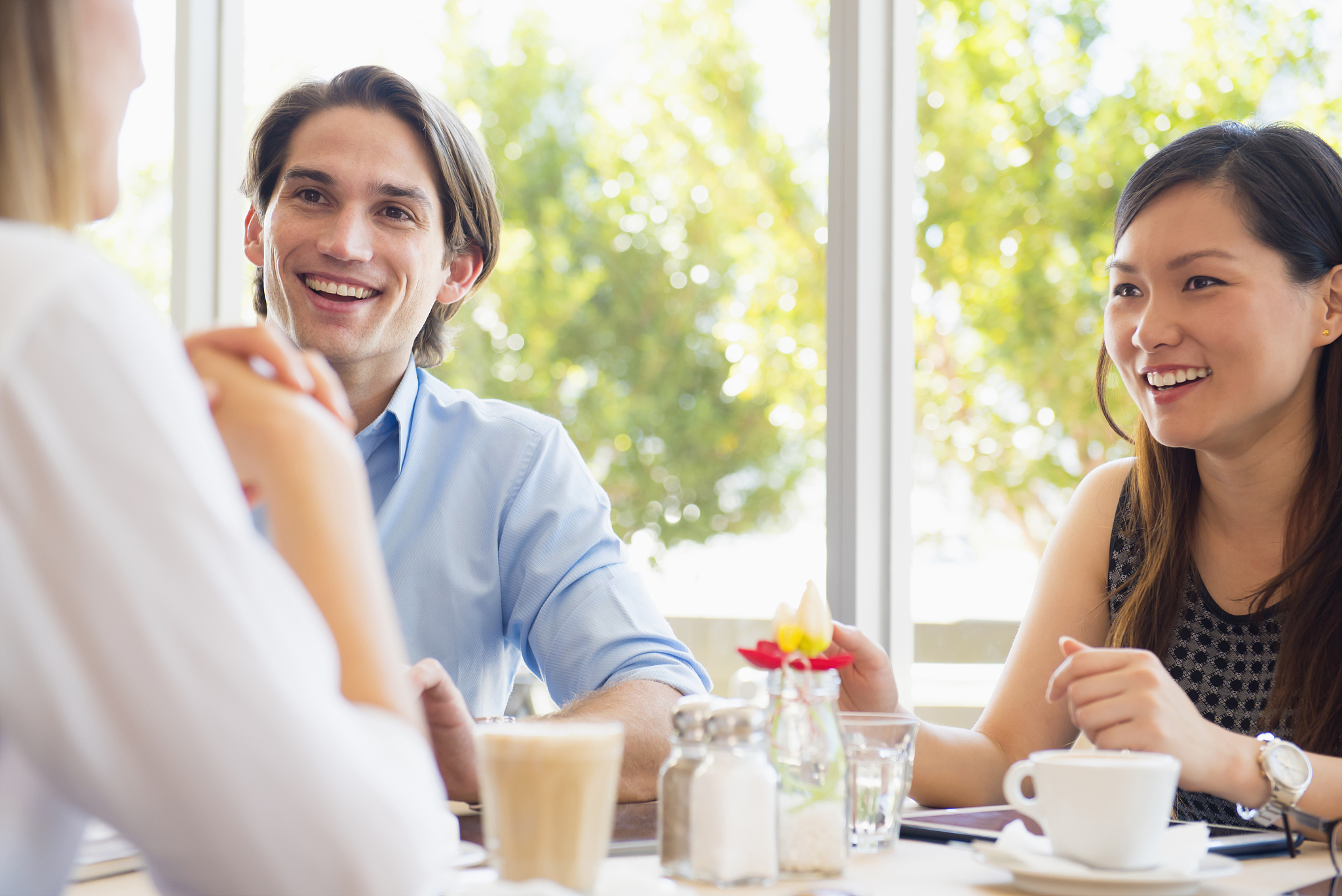 smiling people talking in restaurant
