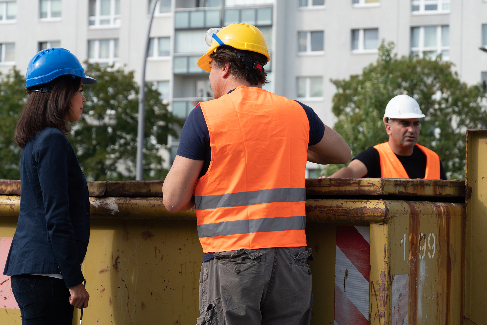 three workers on construction site