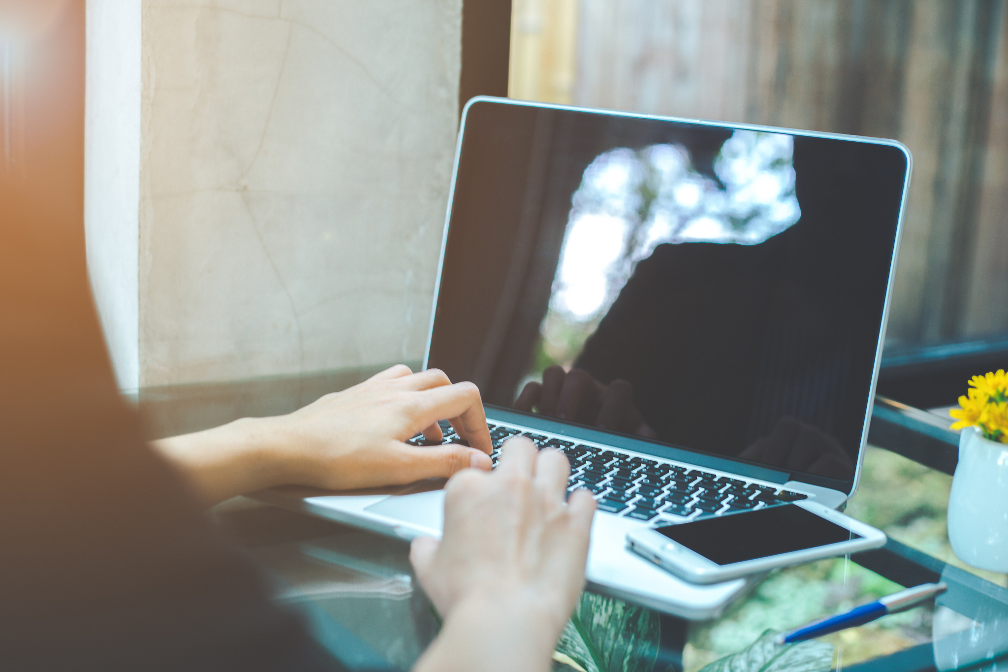 business women are using a laptop computer in the office.