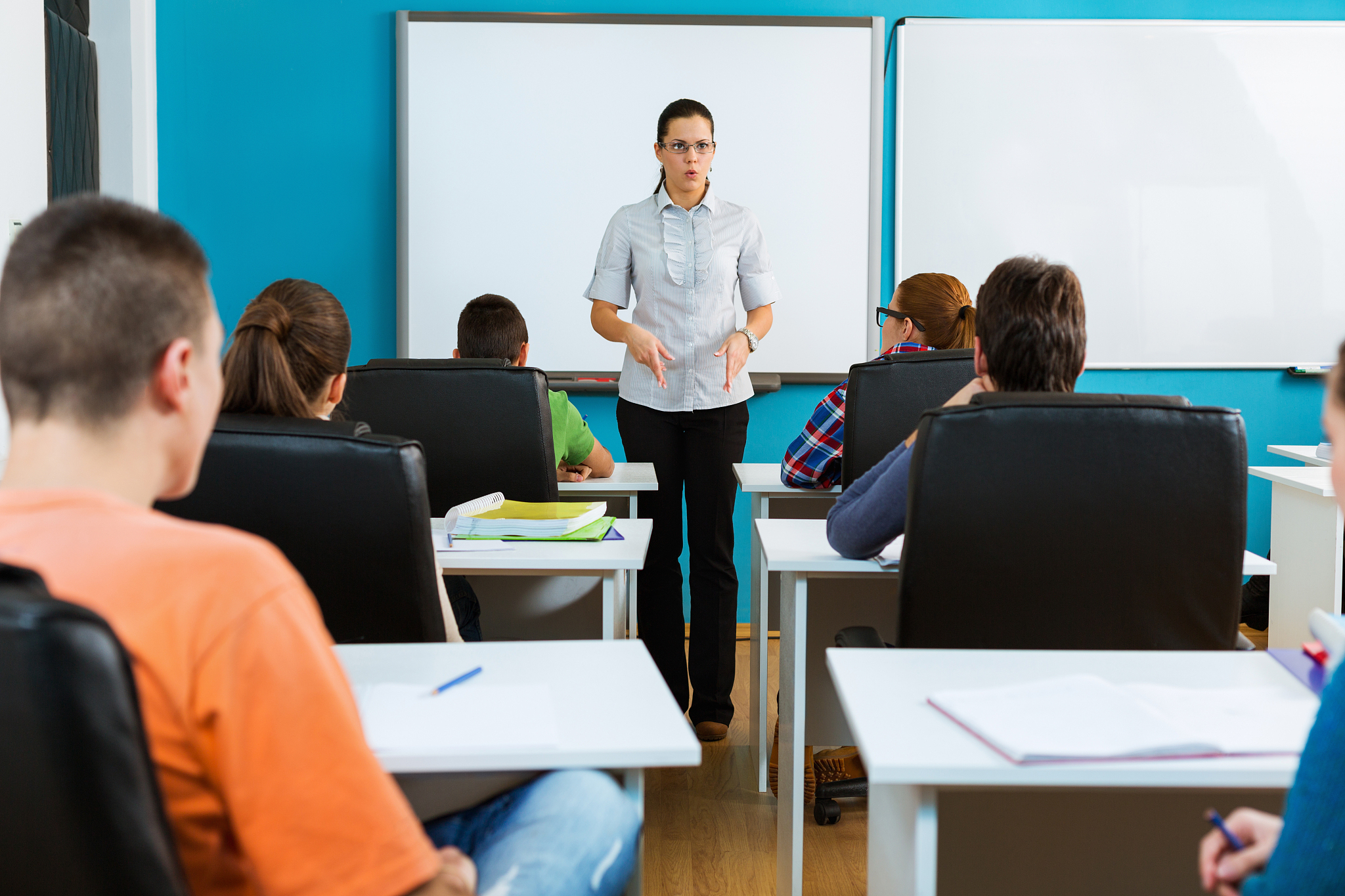 highschool students and teacher in the classroom