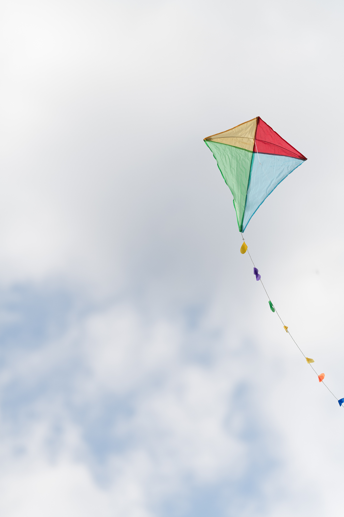 colorful kite in a cloudy sky