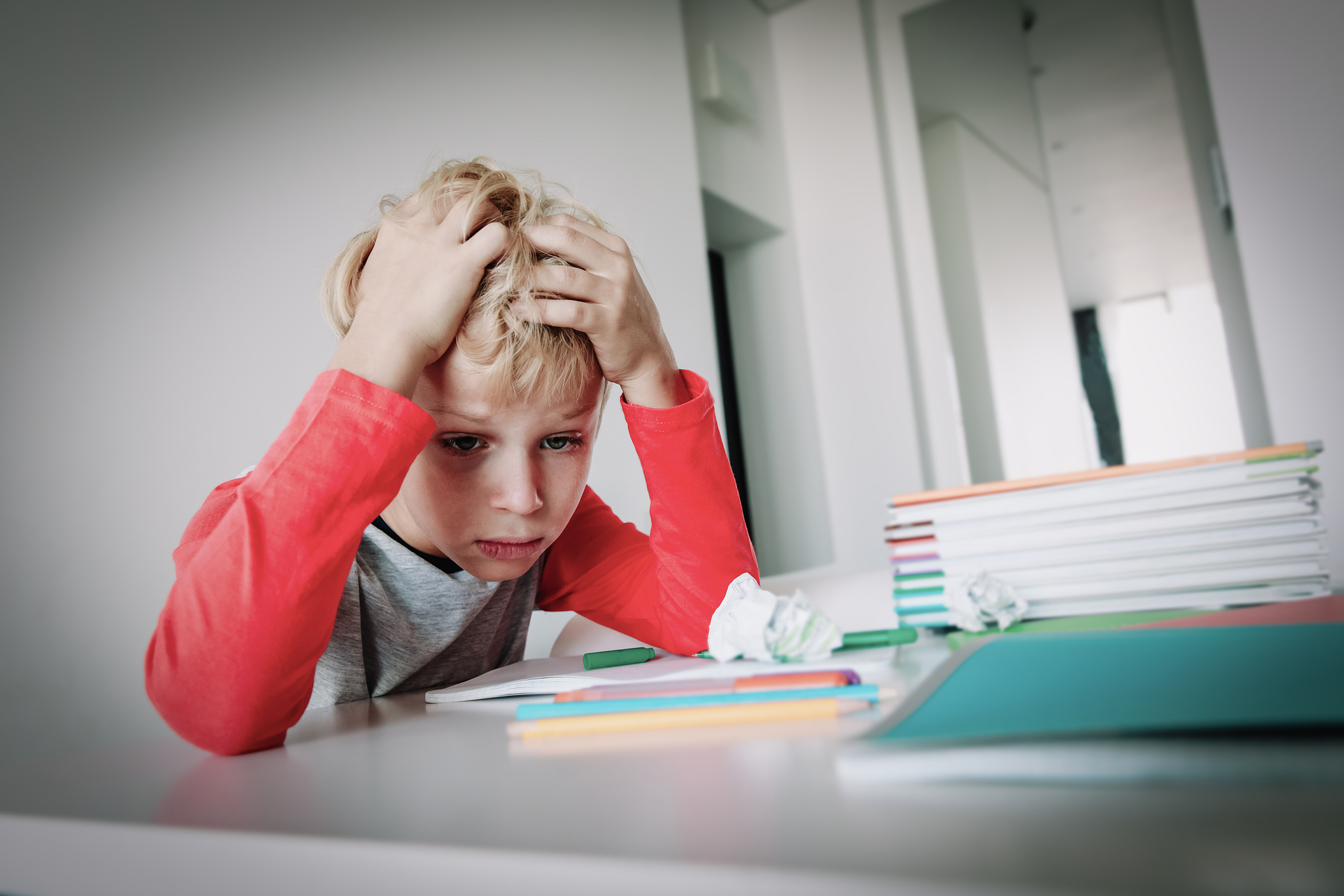 little boy tired stressed of reading, doing homework