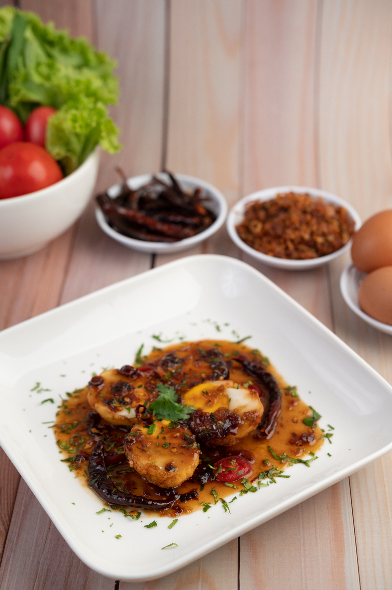 boiled eggs stir-fried with tamarind sauce, topped with fried on