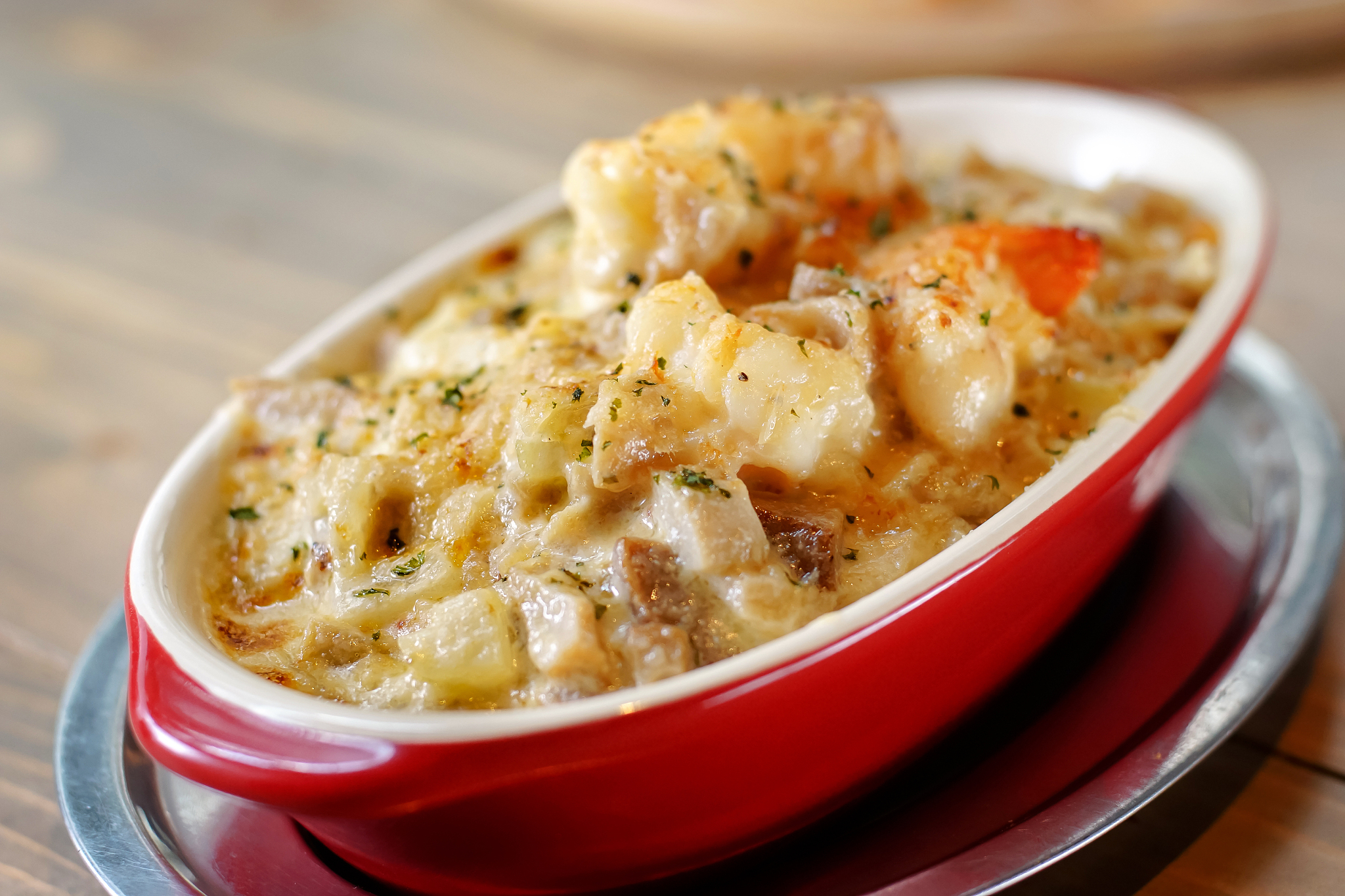 golden baked seafood tomyum lasagna - thai italian fusion food