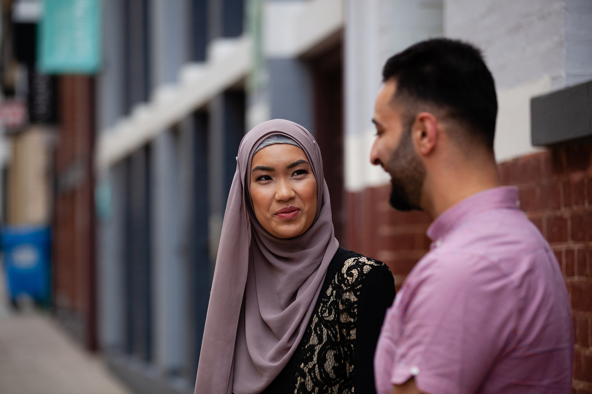 couple chatting on street