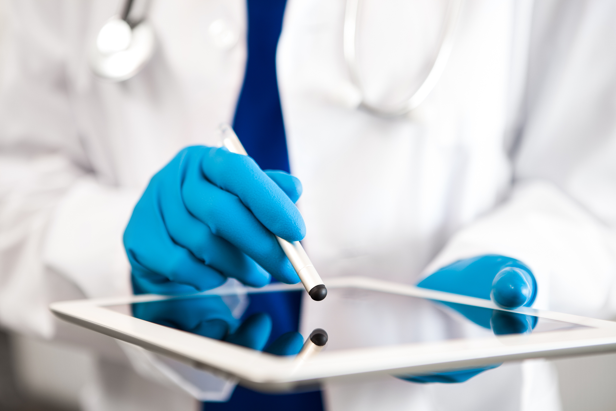 doctor uses digital tablet