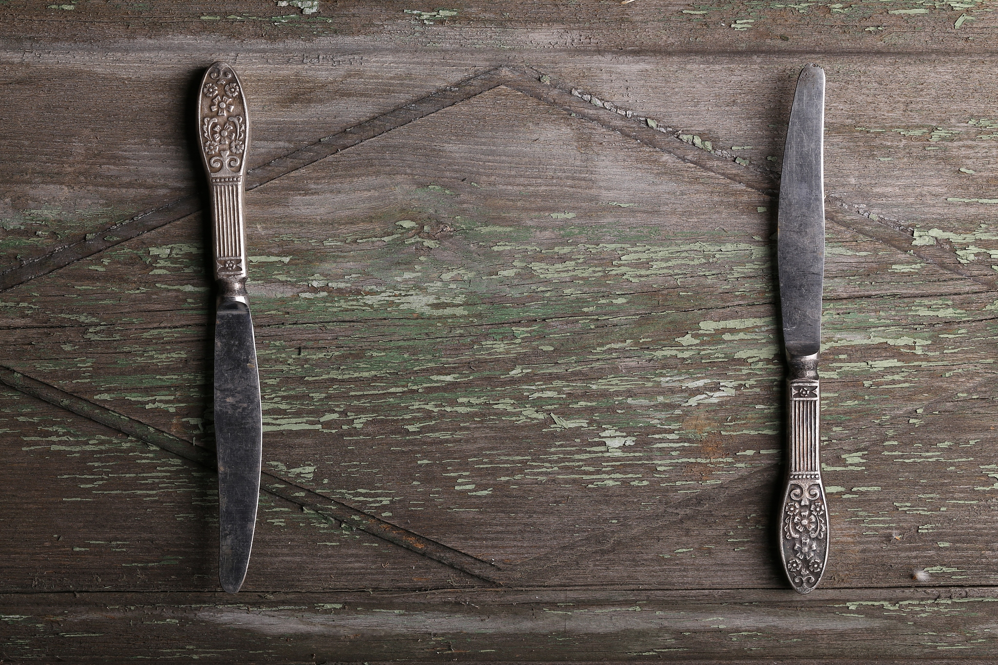 close up of retro cutlery on rustic wooden background with