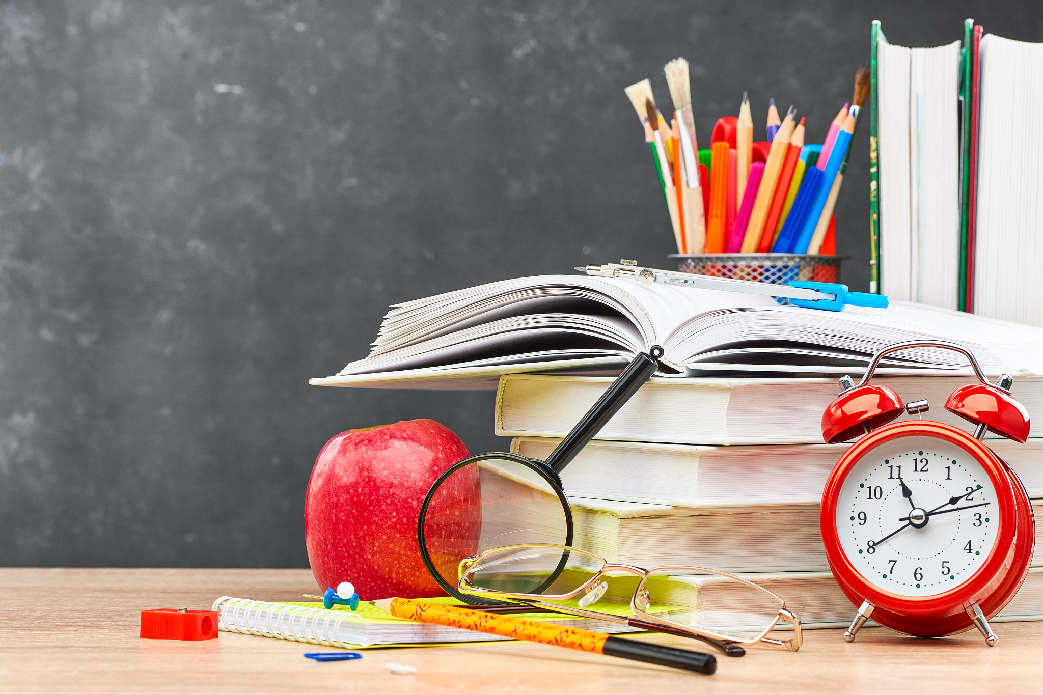 school supplies on a blackboard background