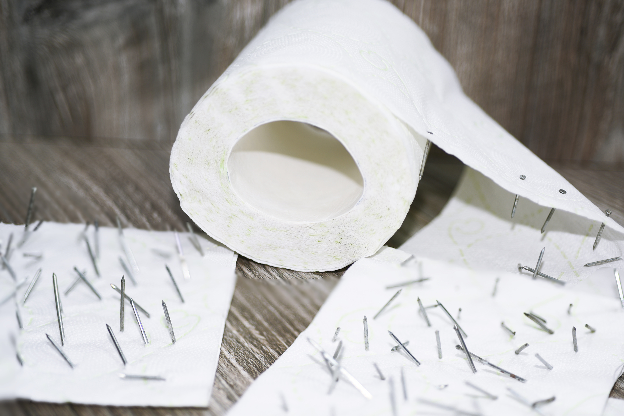 toilet paper with nails in it.