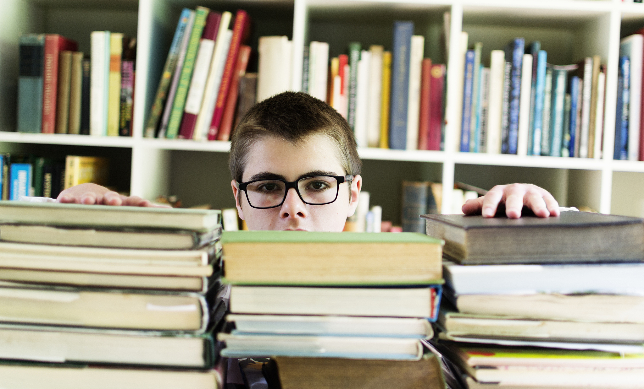 student looking over books