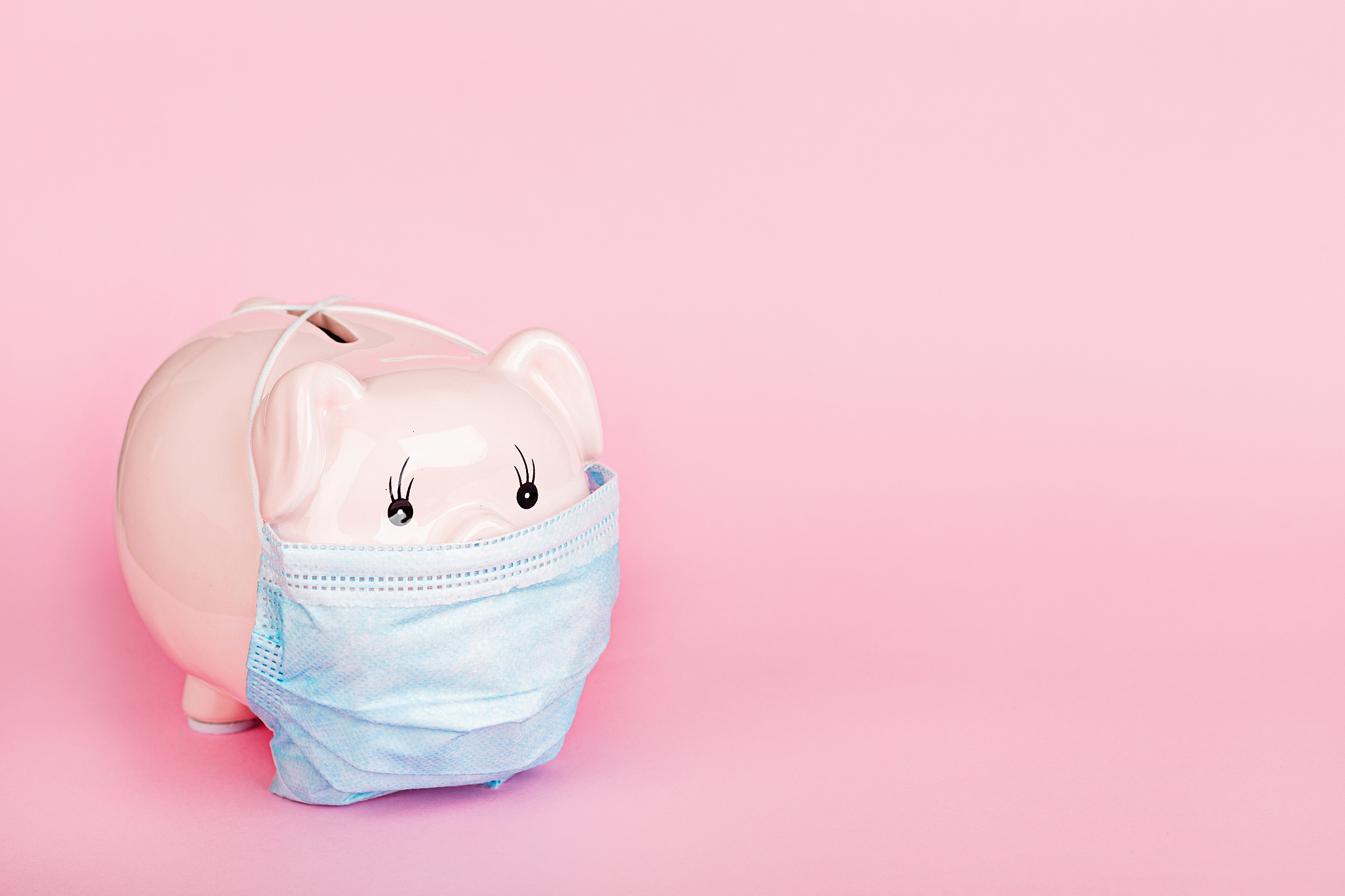 piggy bank in medical mask on pink background. mockup, template,