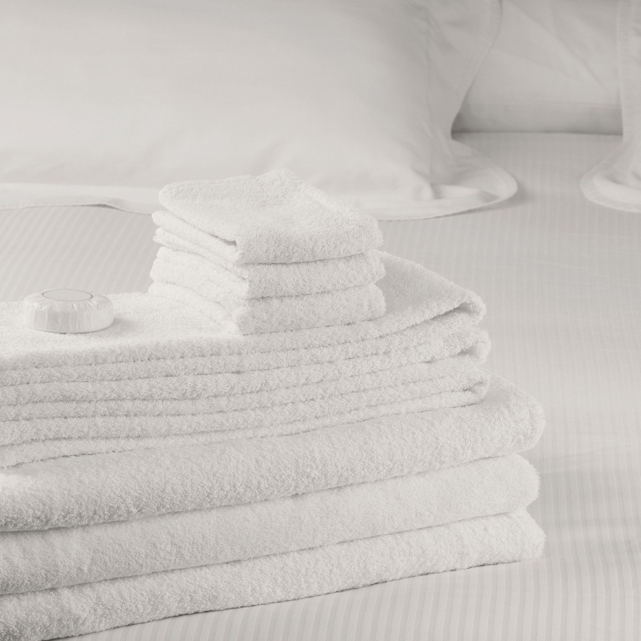 close-up of a stack of towels on the bed