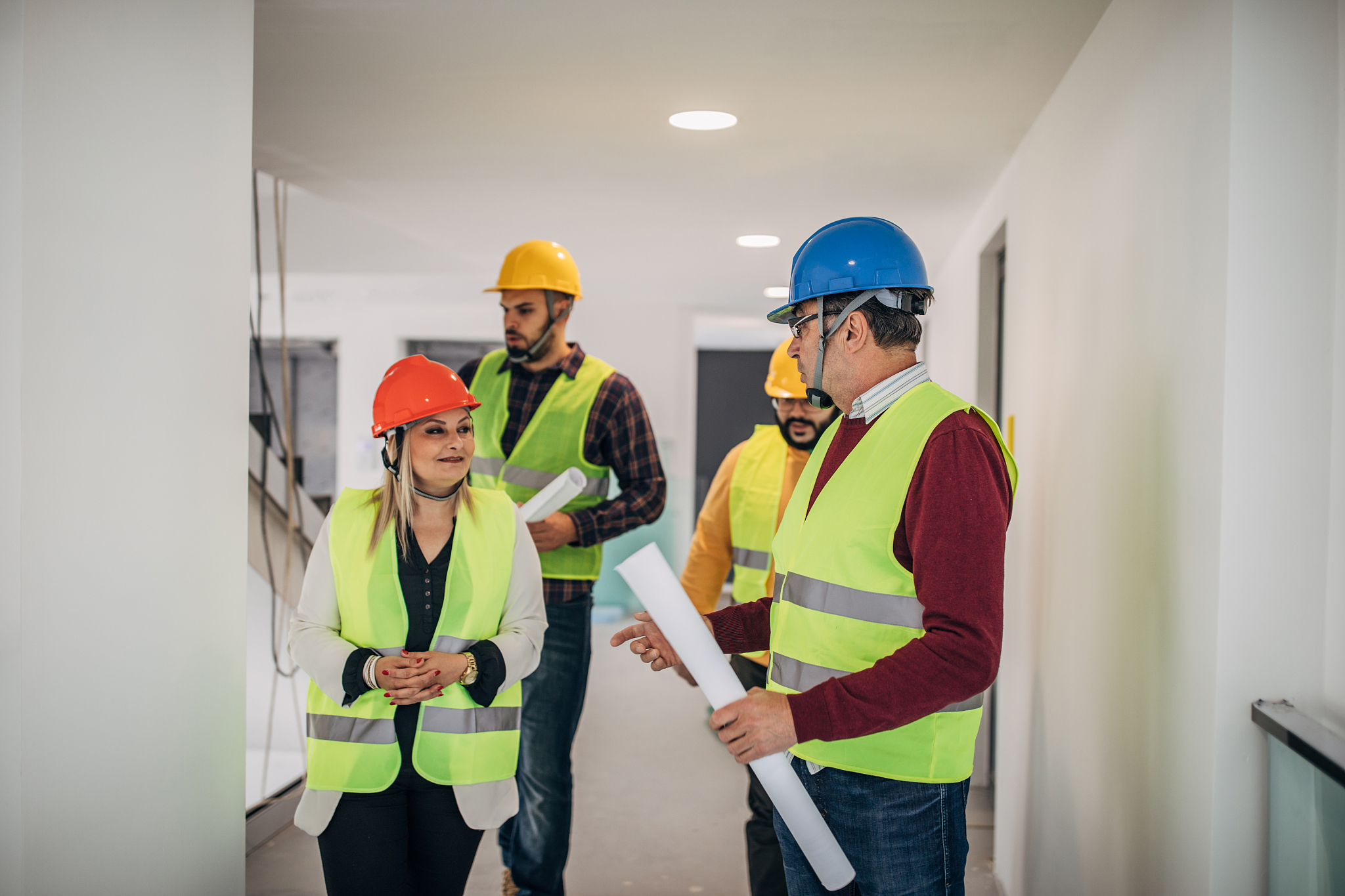 architects team standing at construction site indoors
