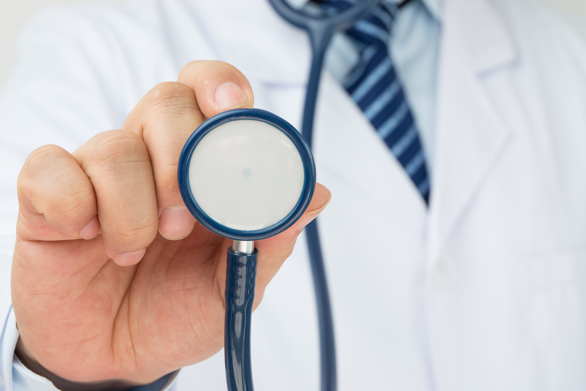 doctor holding a stethoscope auscultation