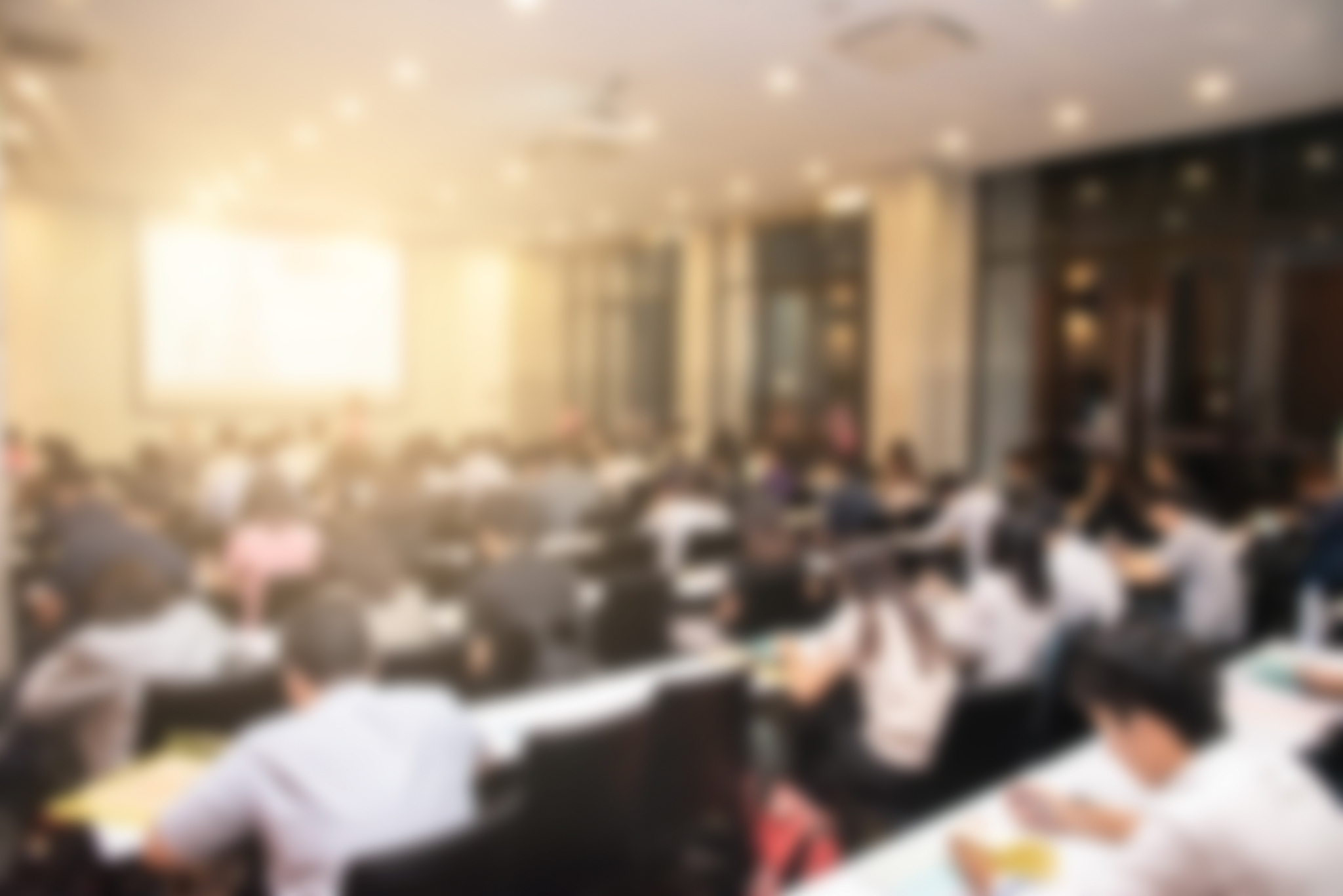 blurred background of business people in conference hall or semi