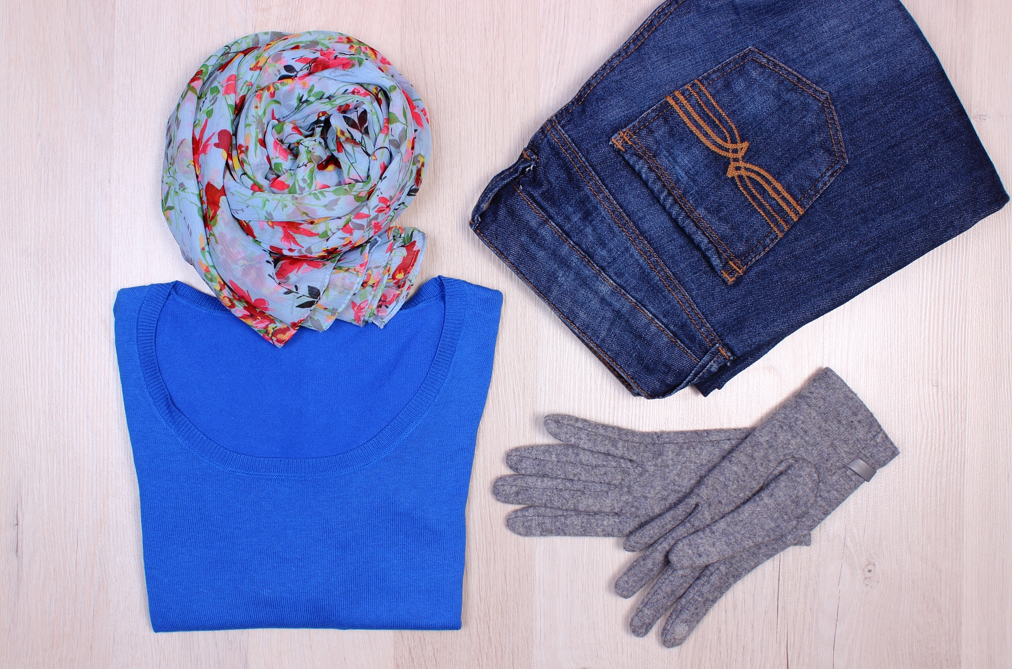 womanly clothes on wooden background, clothing for autumn or win