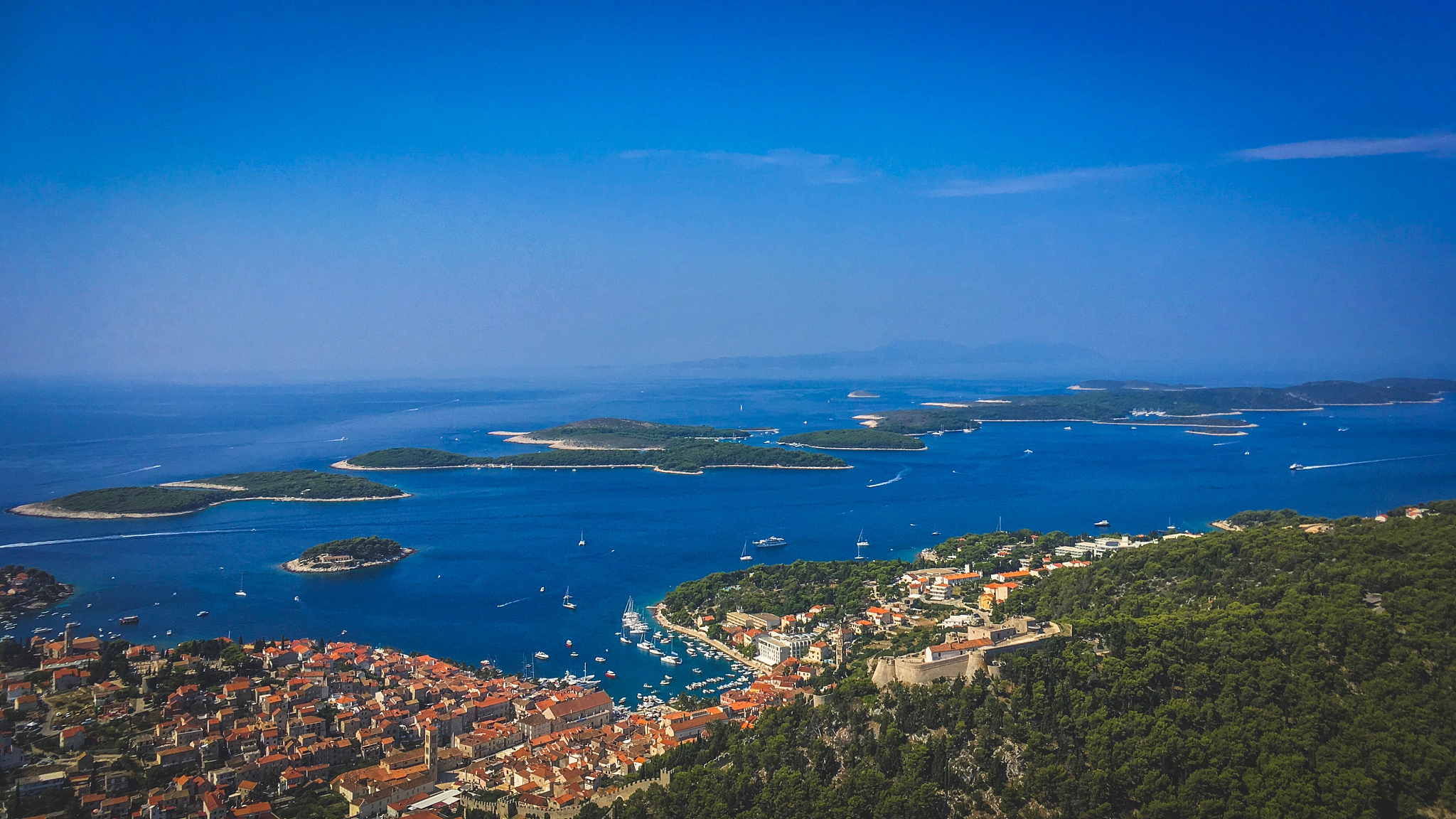 high angle view of bay against blue sky