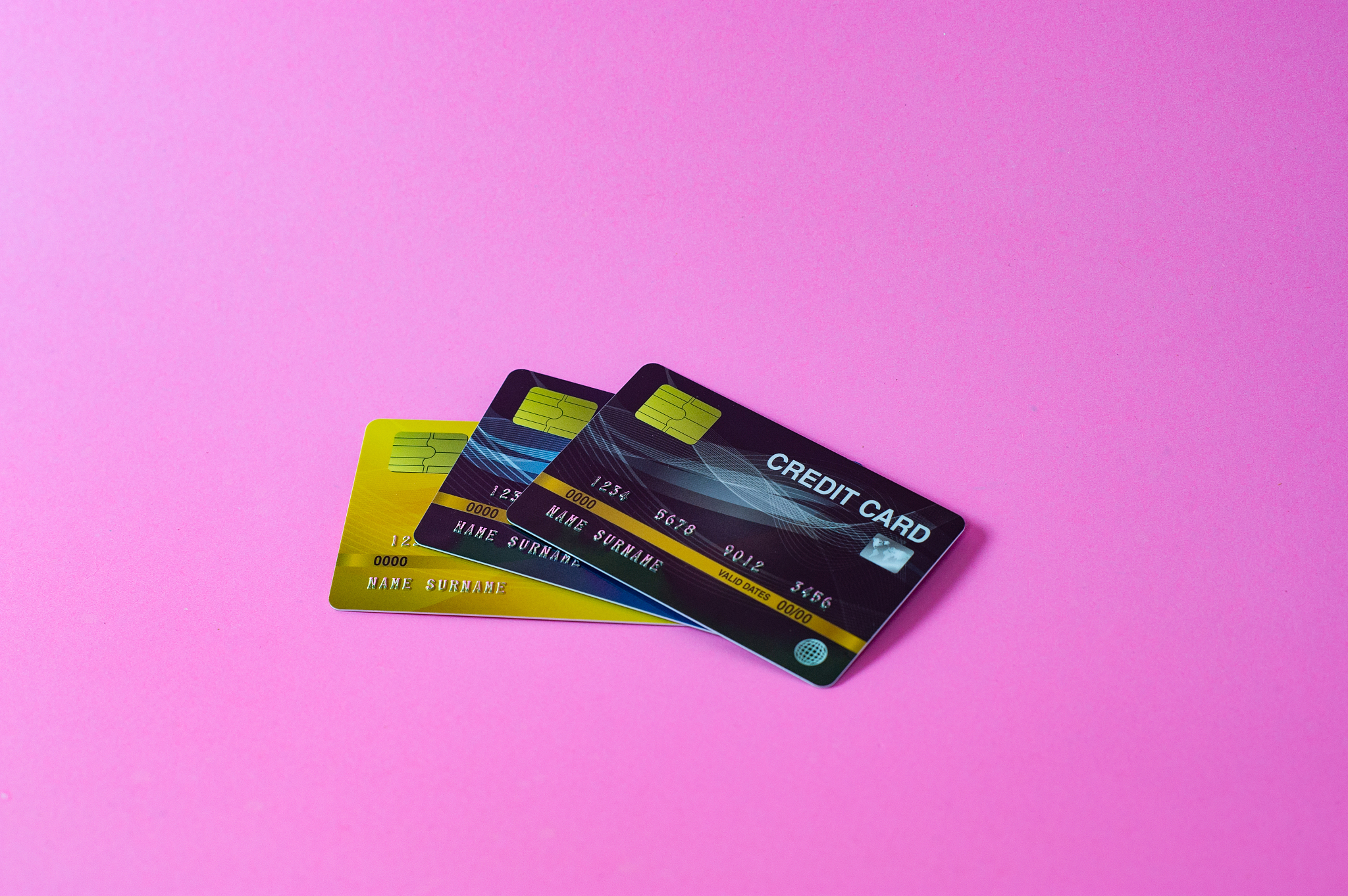 credit card on pink background