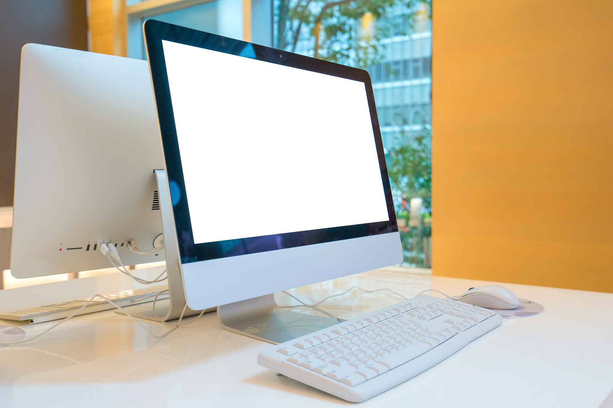 computer desktop with keyboard, diary and other accessories on t