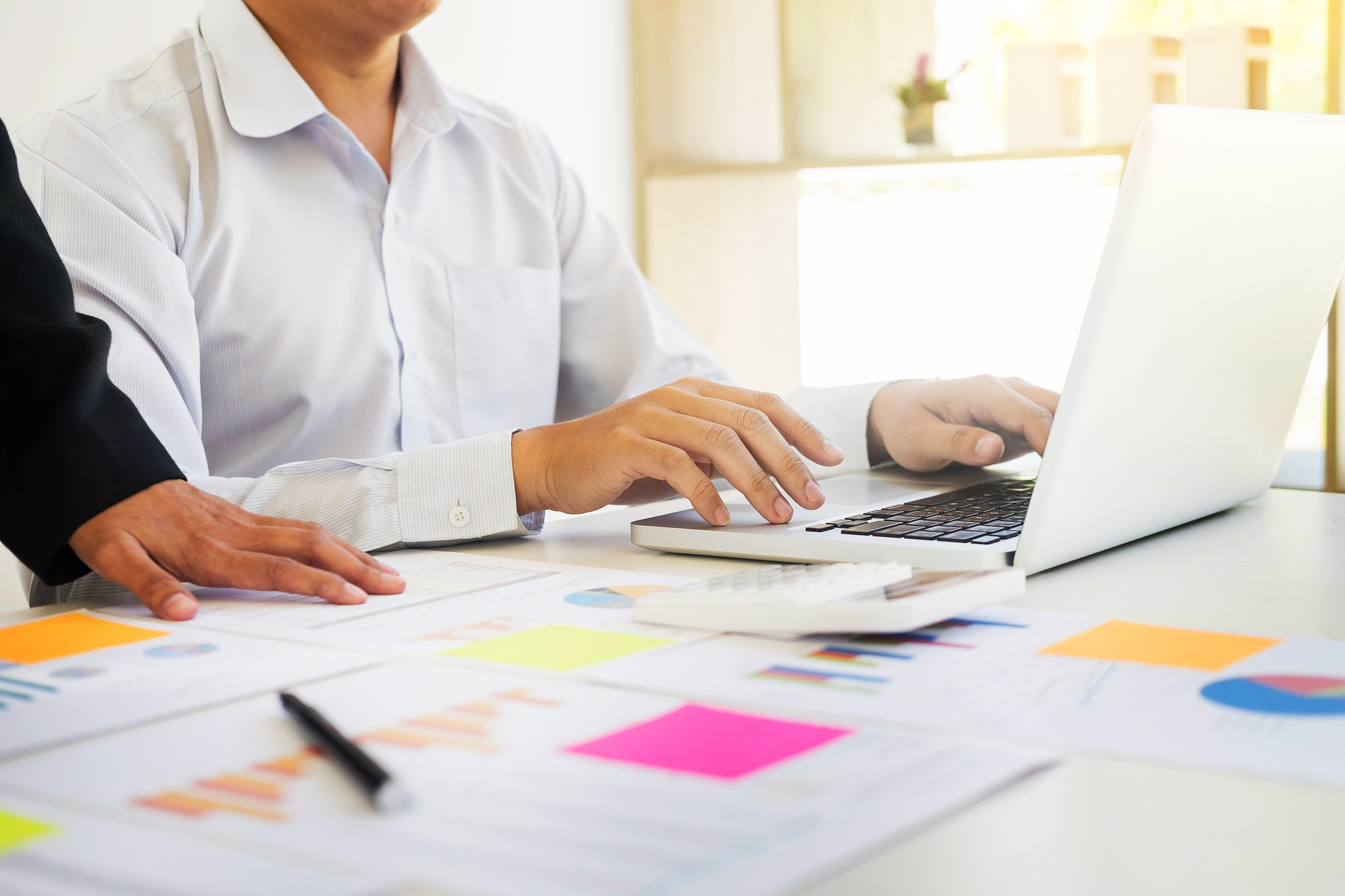 midsection of business colleagues working at office