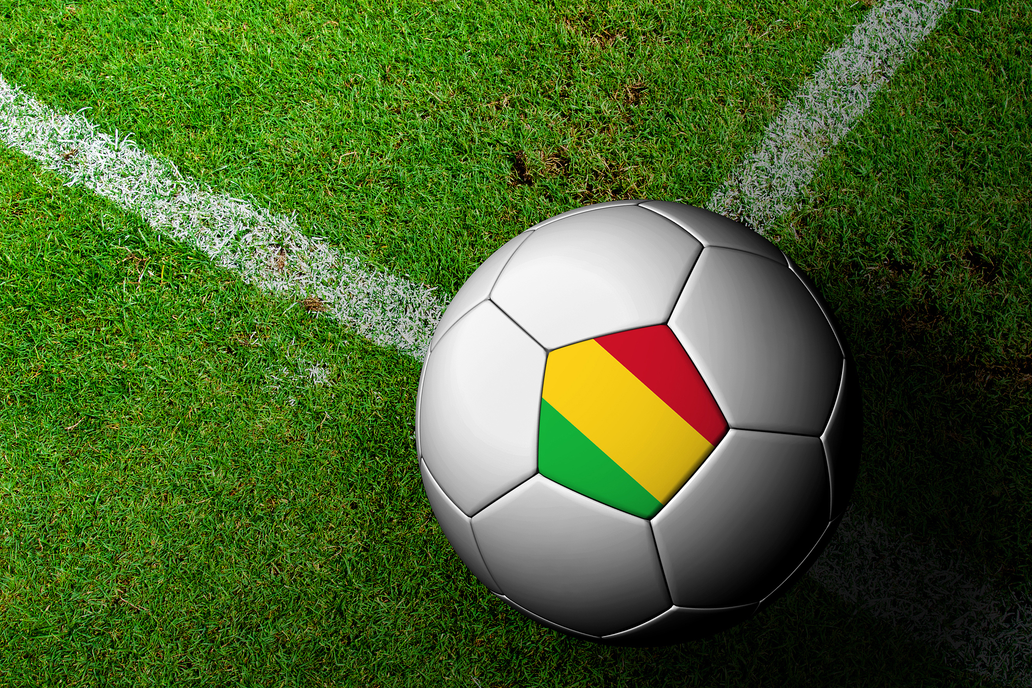 mali flag pattern of a soccer ball in green grass