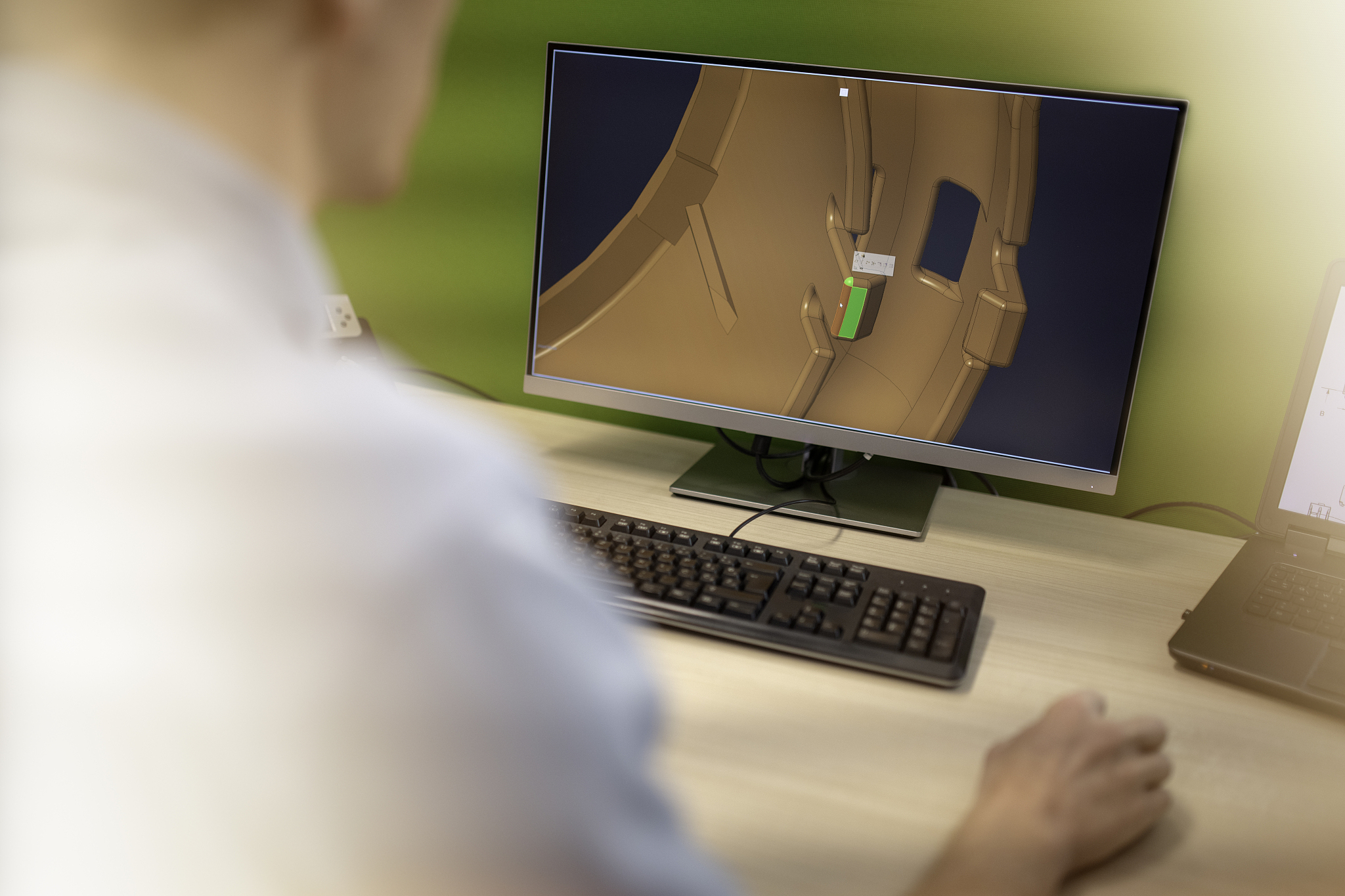 engineer working on 3d machine part model
