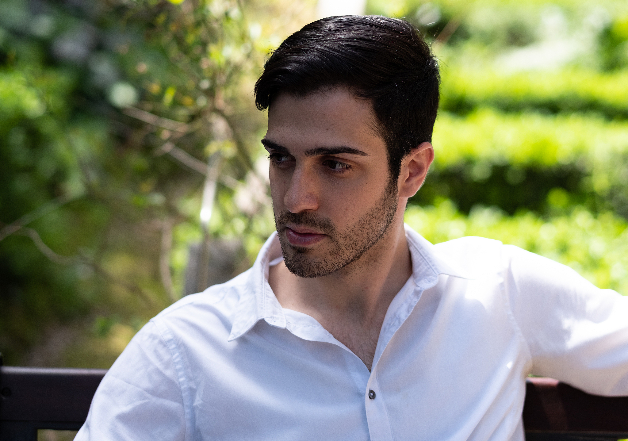 close-up of man sitting outdoors