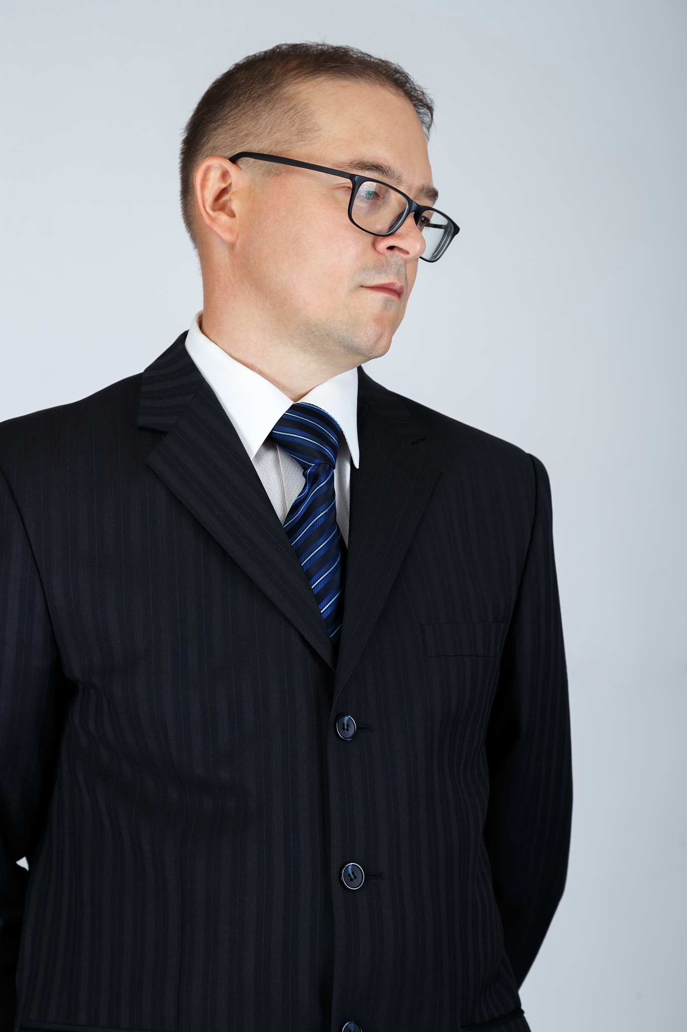 young serious business man is thinking