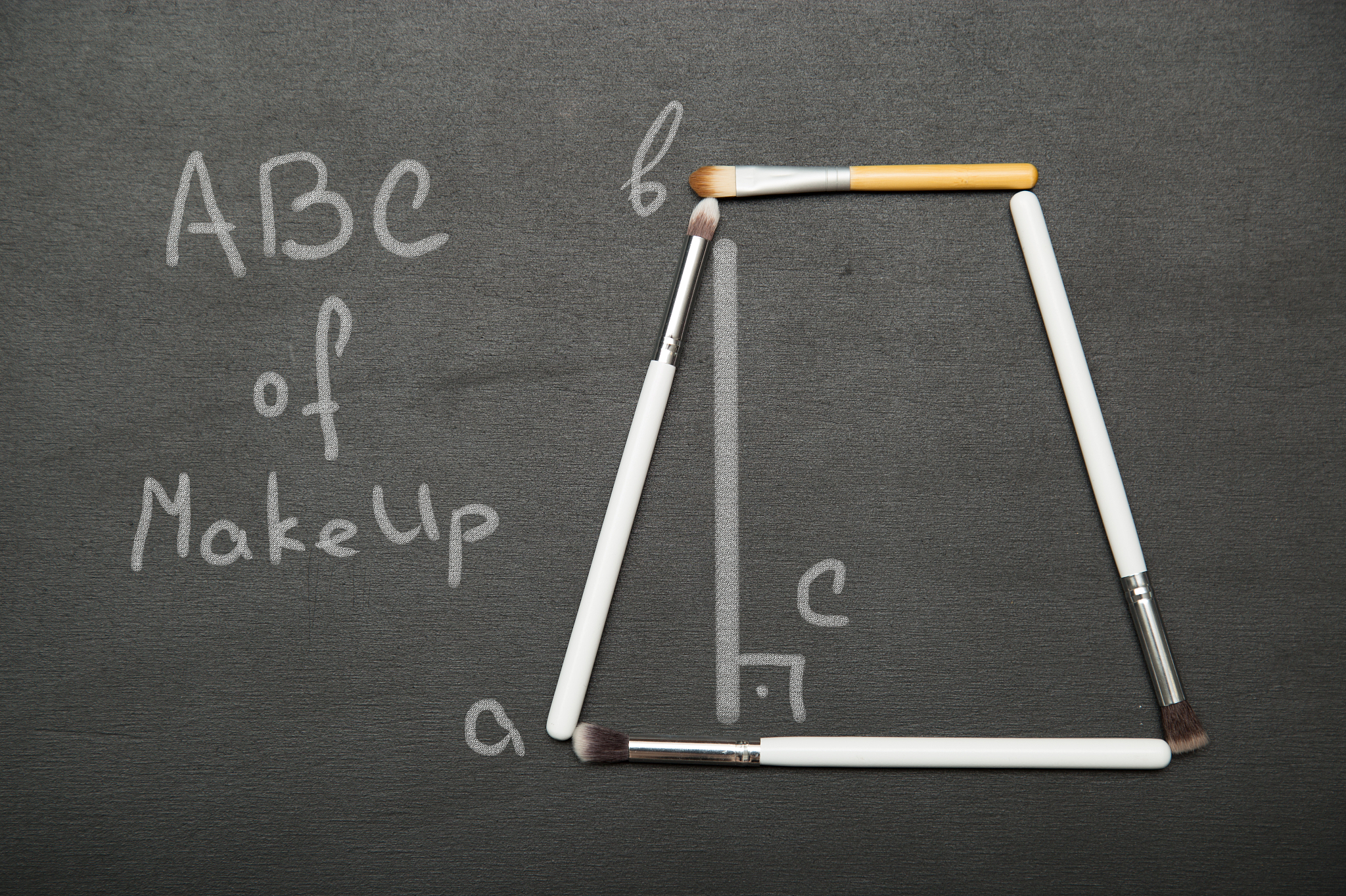 abc of make up  picture. figures, made with cosmetic brushes.