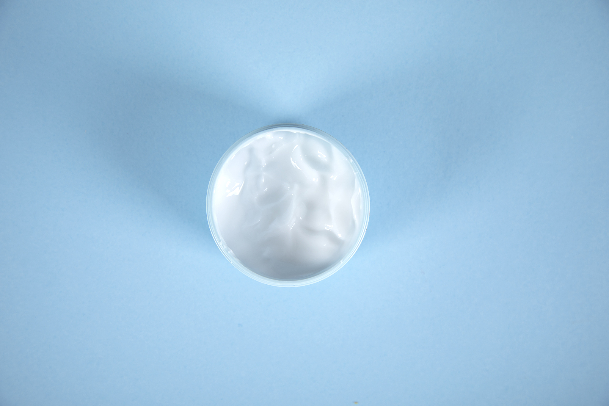 face cream on the blue table