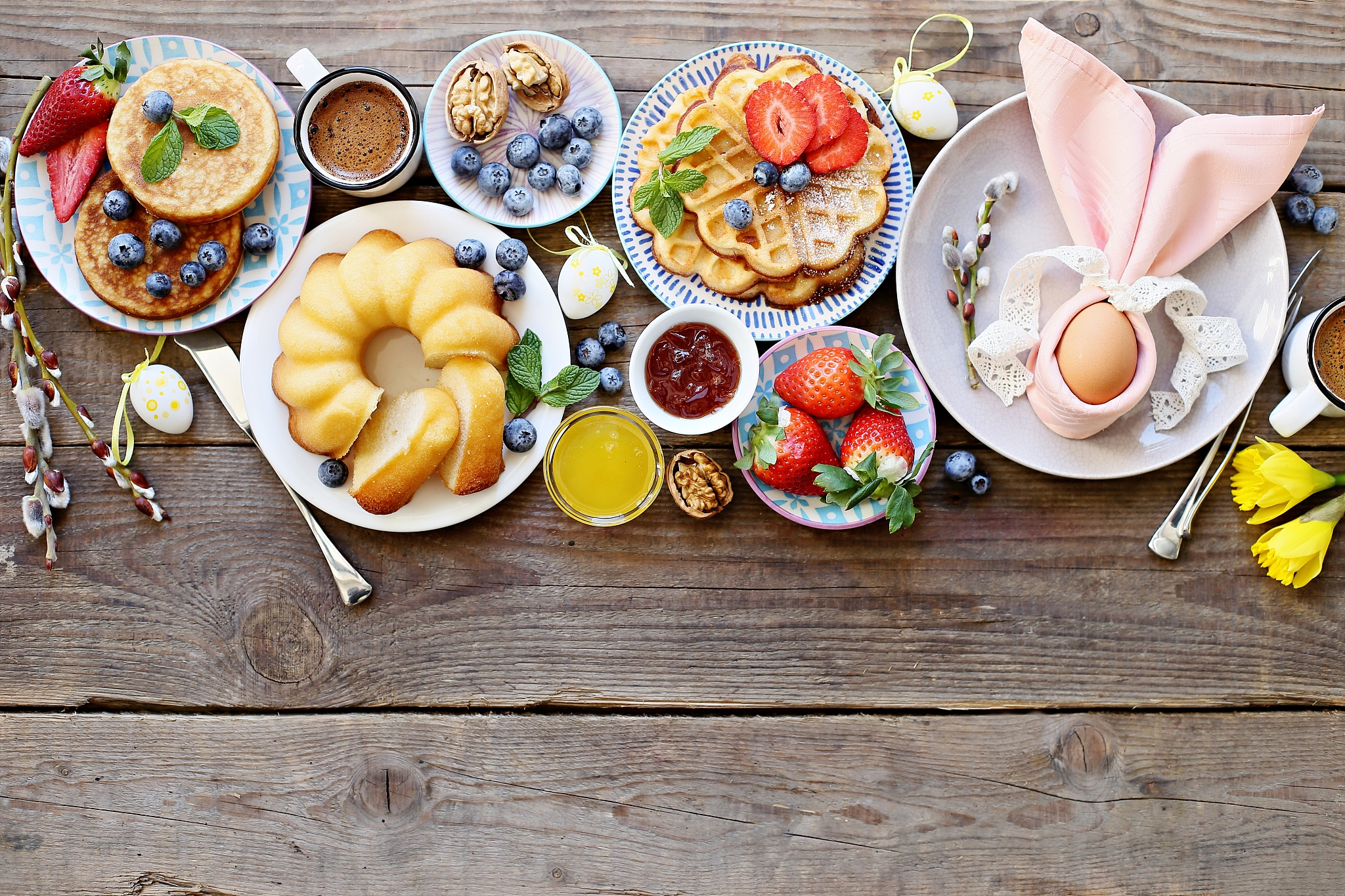easter dessert table. pancakes,waffles and bundt cake with fresh