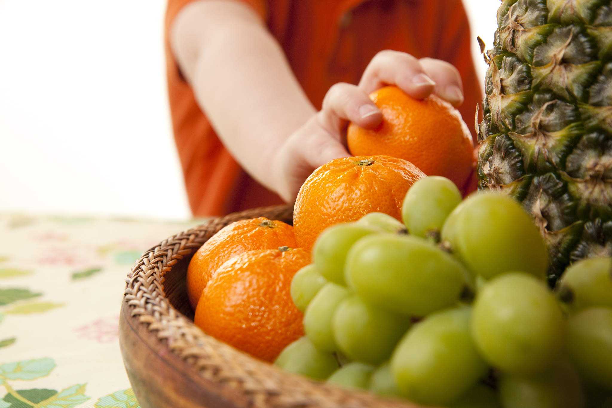 child eating healthy fruit basket