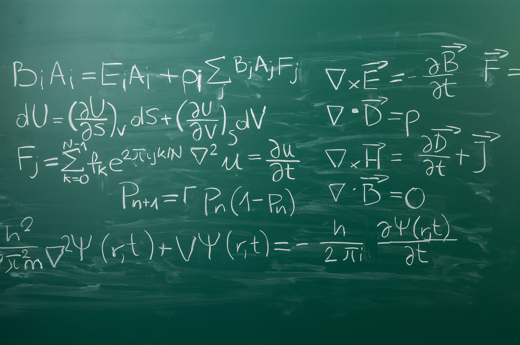 close-up on hand written physics formula, blackboard
