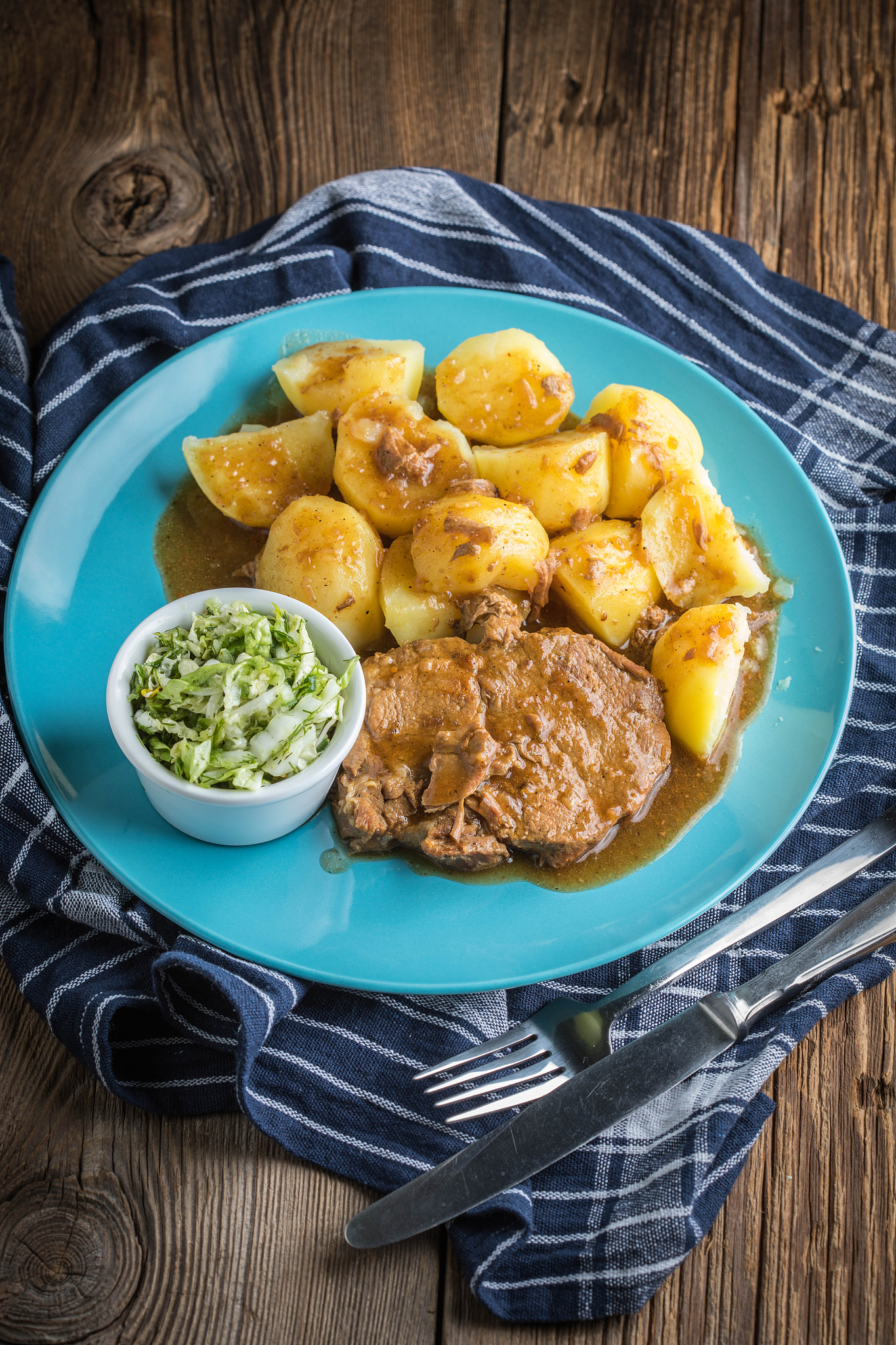 braised meat in sauce served with boiled potatoes.