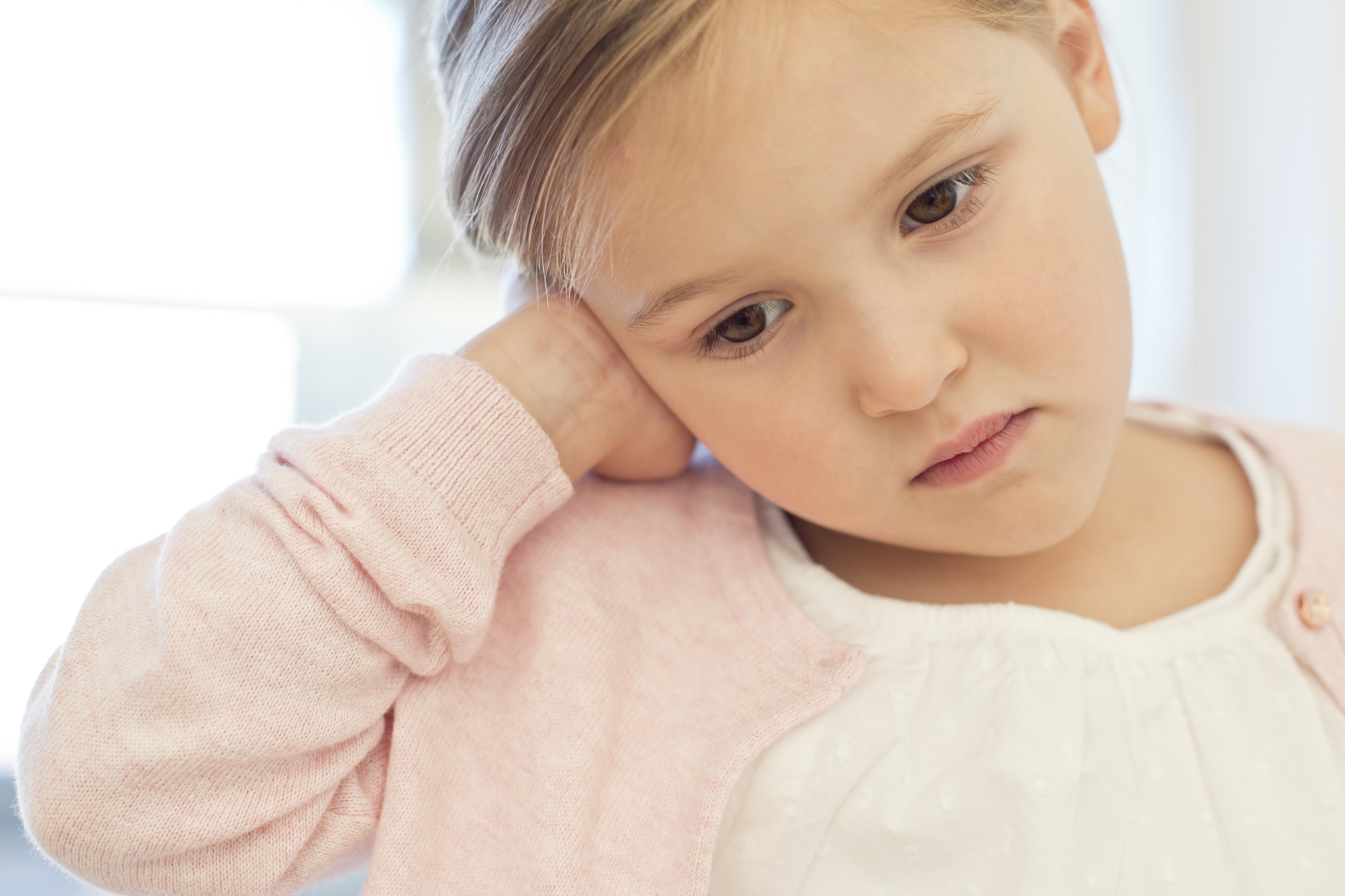 young girl with ear ache