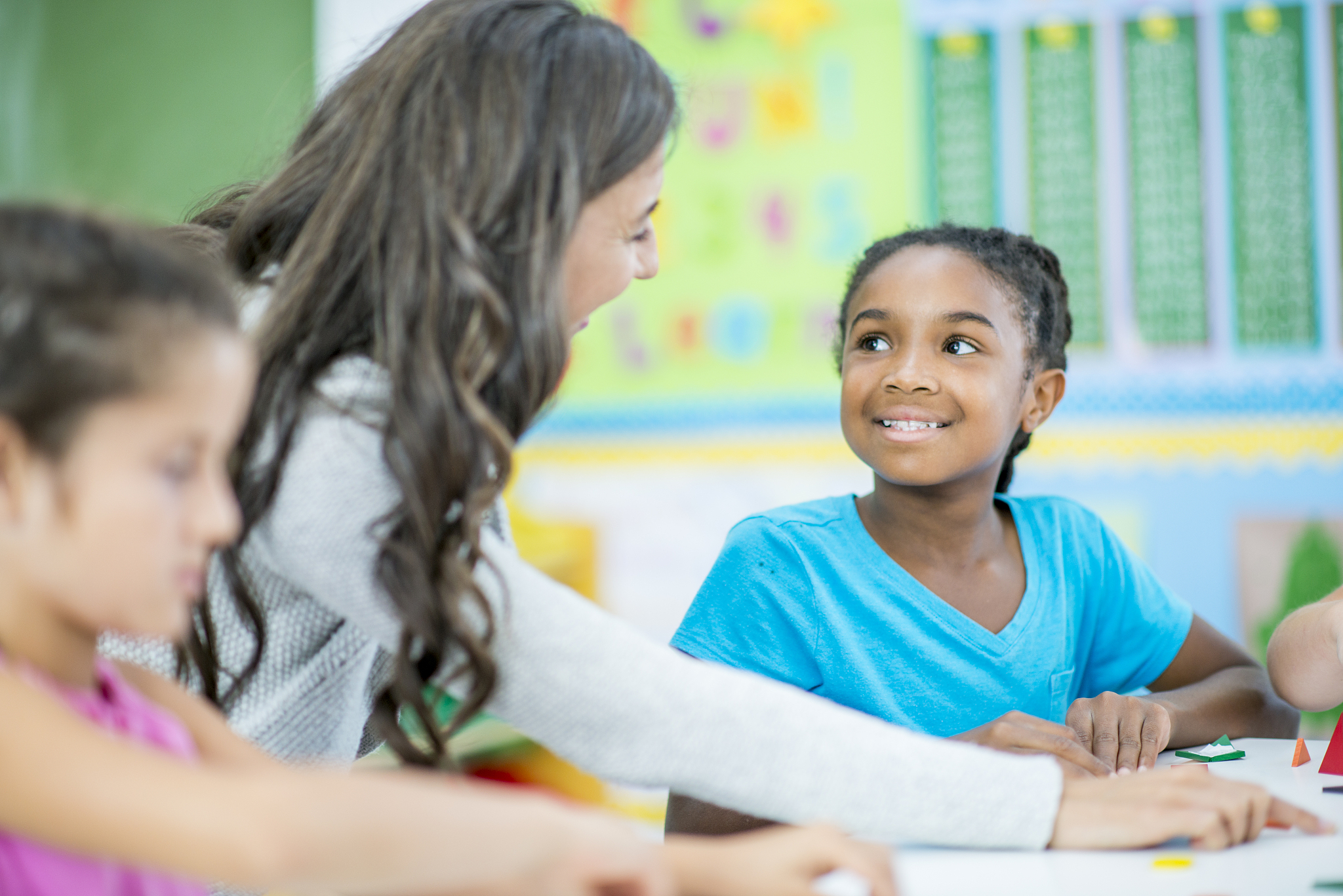 student chatting with teacher
