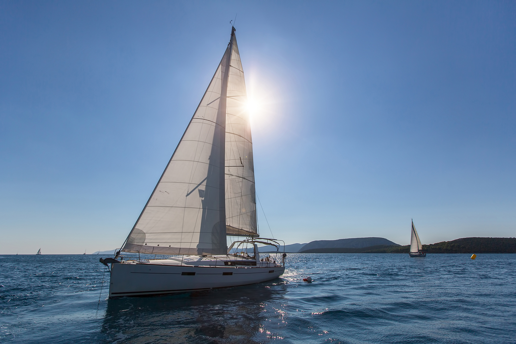 sailing ship yachts regatta, shot boat against the sun.