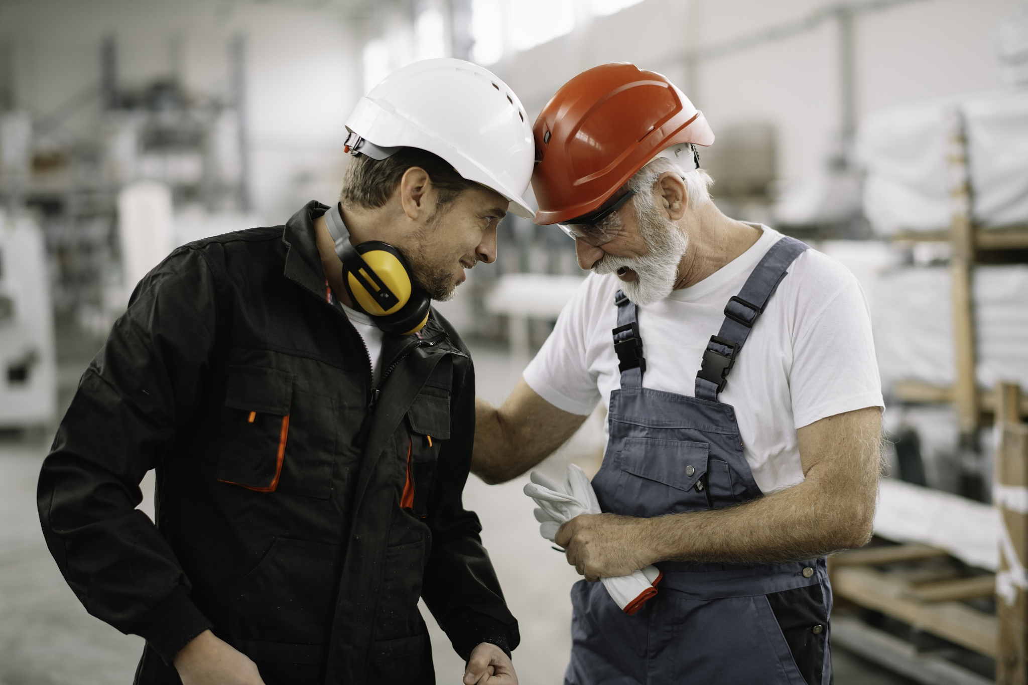 colleagues working together in factory.