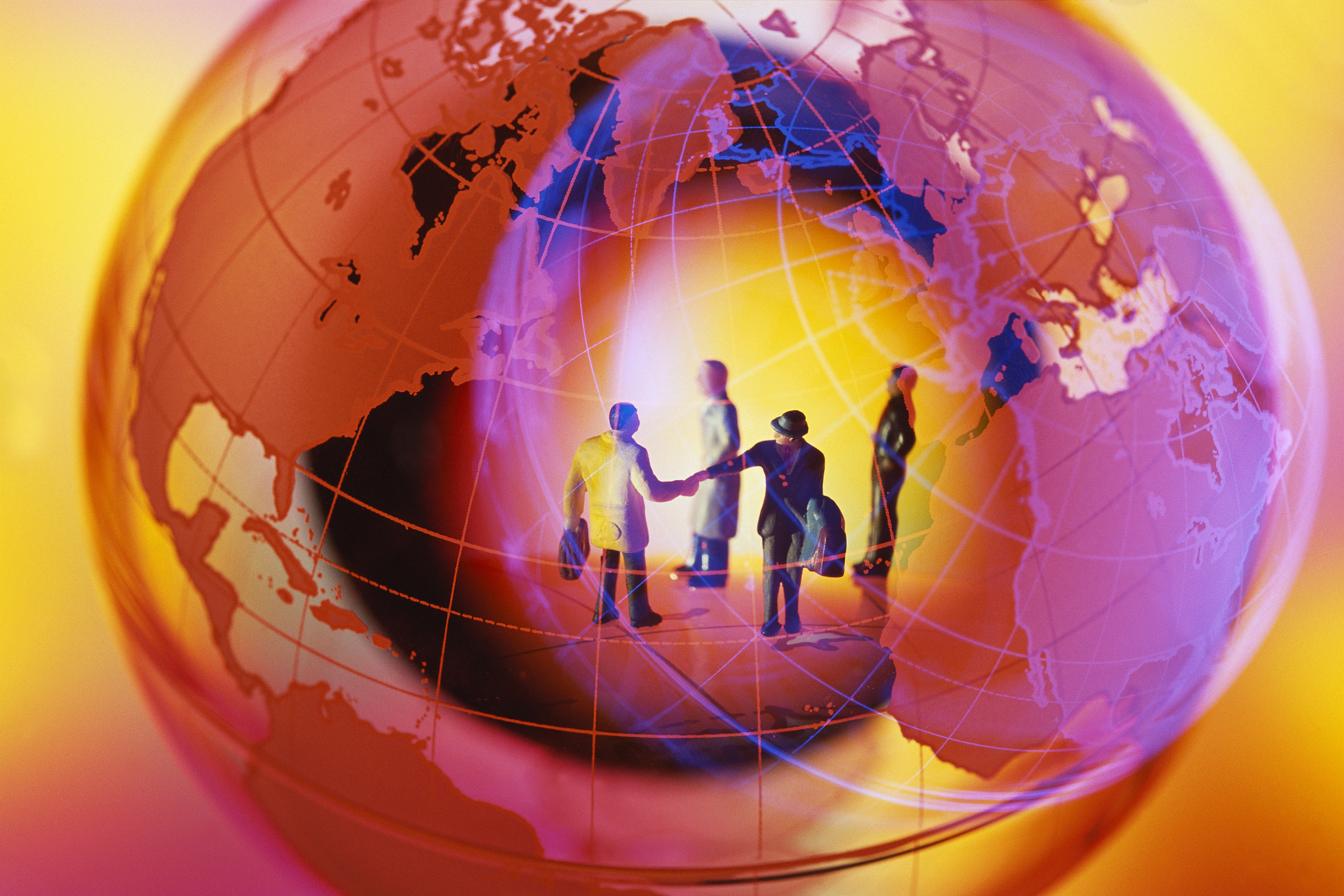 businesspeople projected on globe