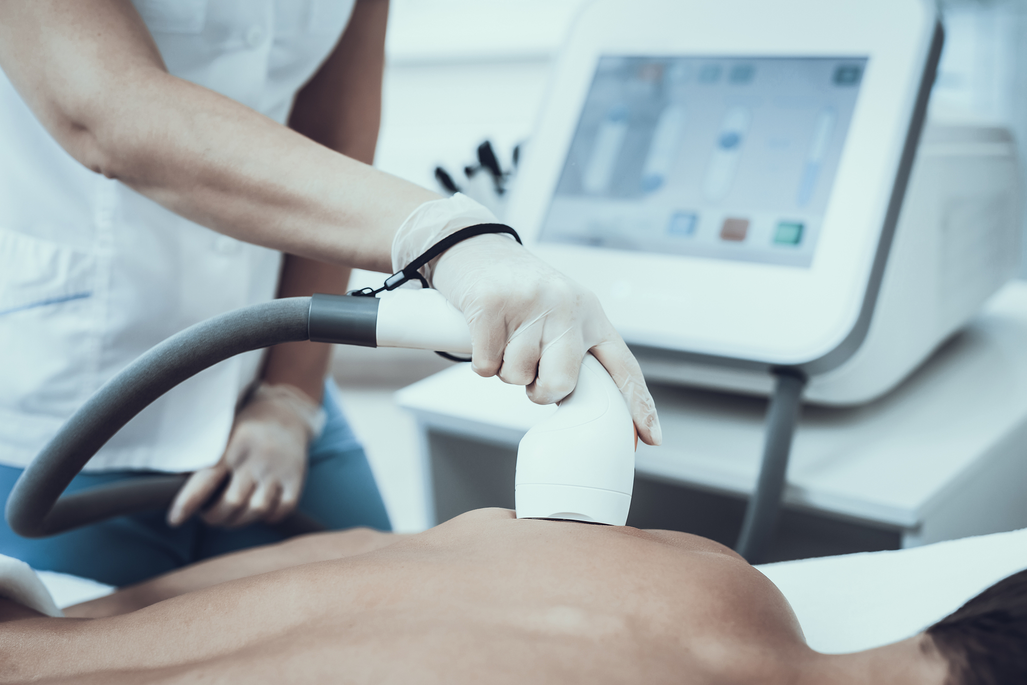 young man in spa salon for laser hair removal.