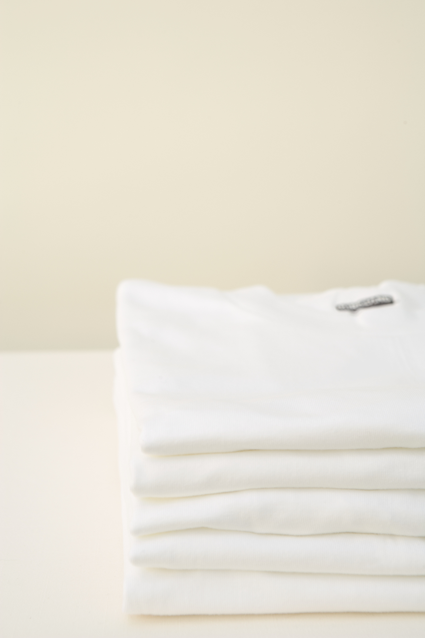 stack of white t-shirts
