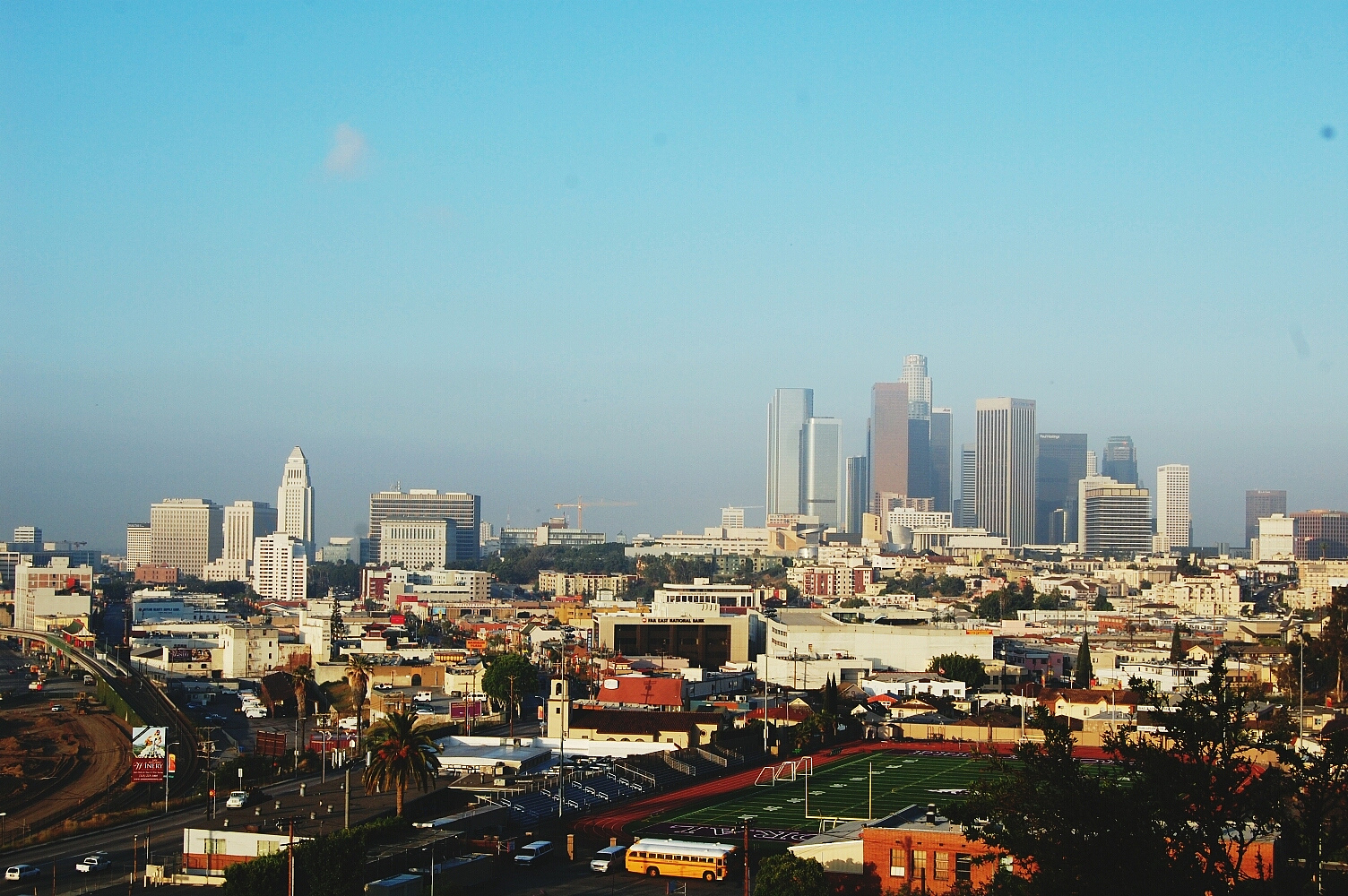 high angle view of cityscape against blue sky