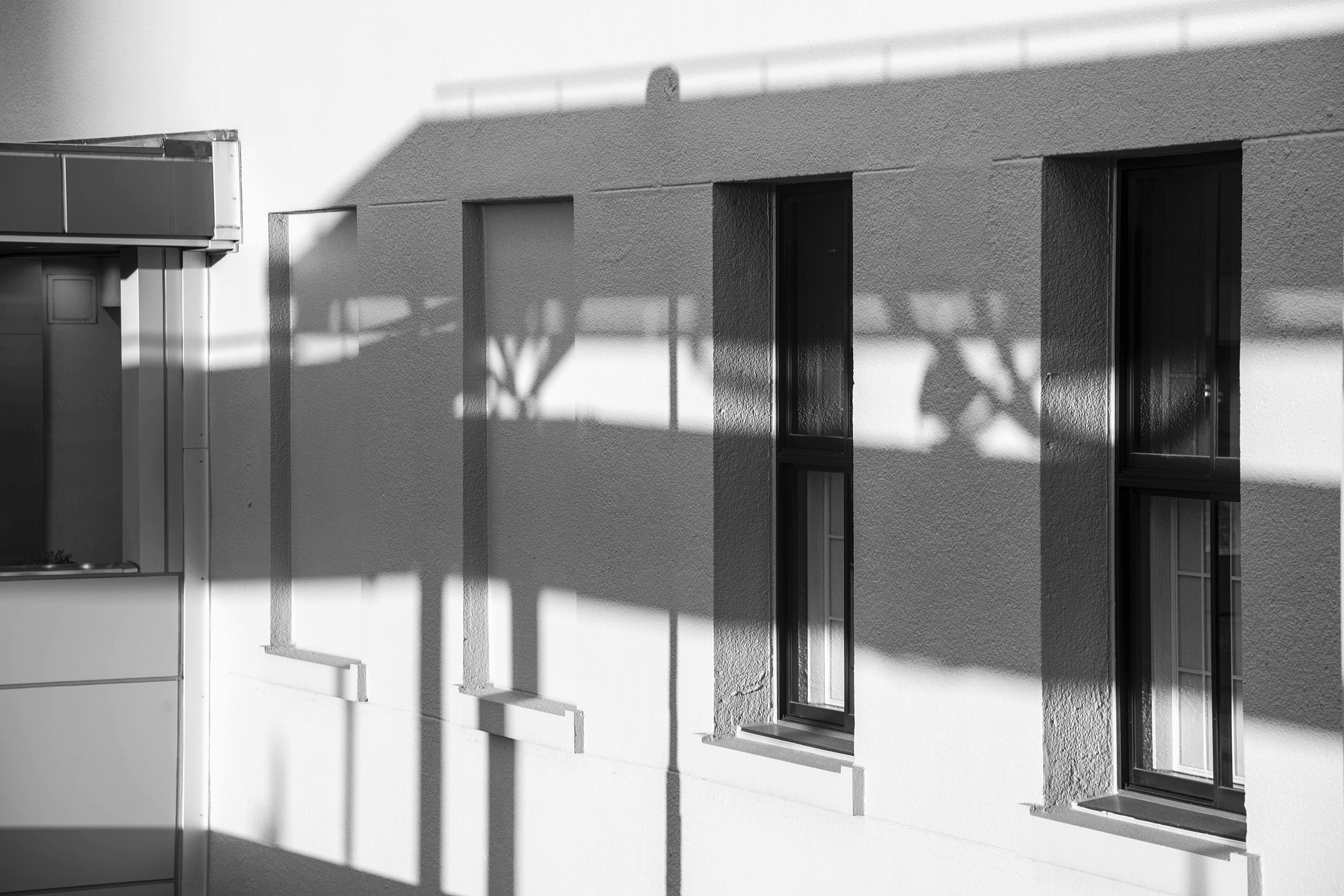 abstract background of a white wall with shadows from the window
