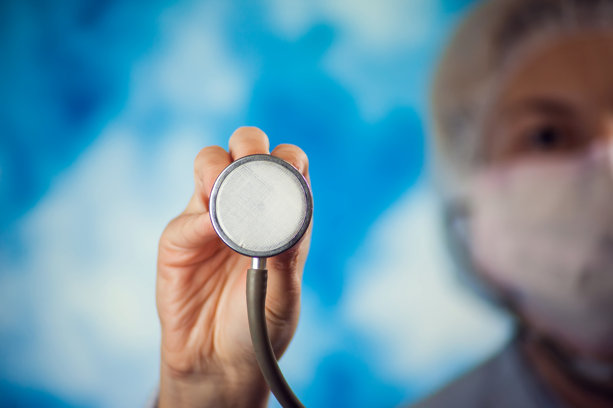 doctor holding phonendoscope. people, medicine and healthcare co