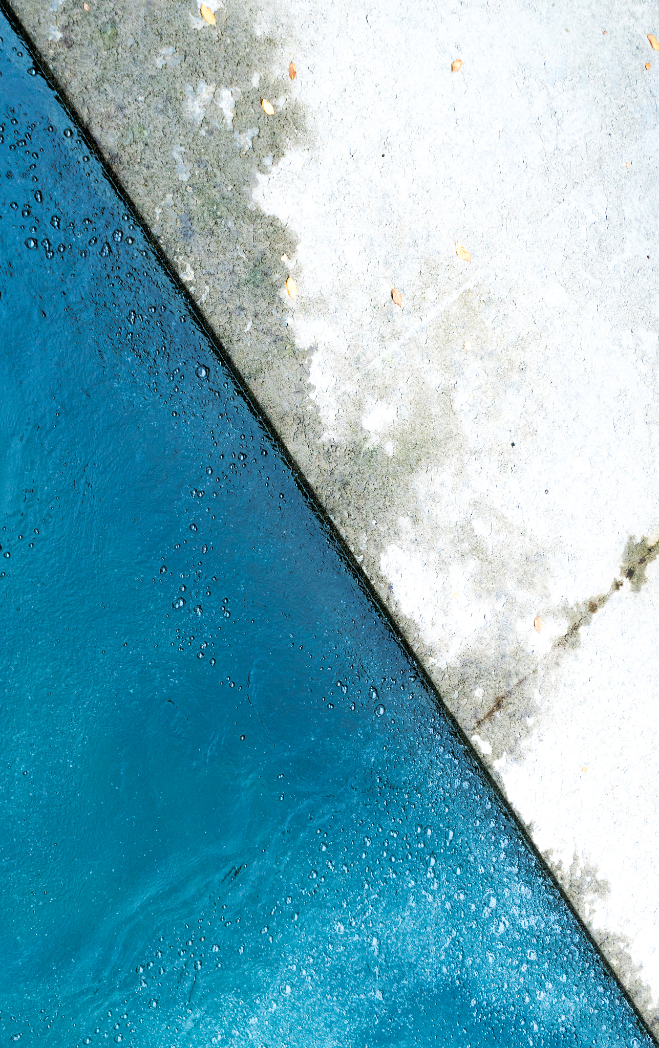 concrete wall encasing a blue river abstract background view res