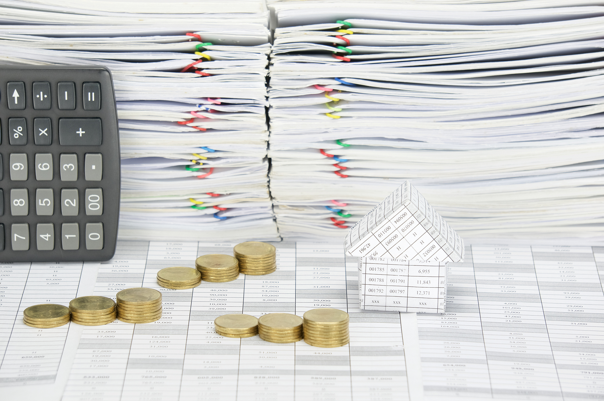 house and step pile of gold coins on finance account