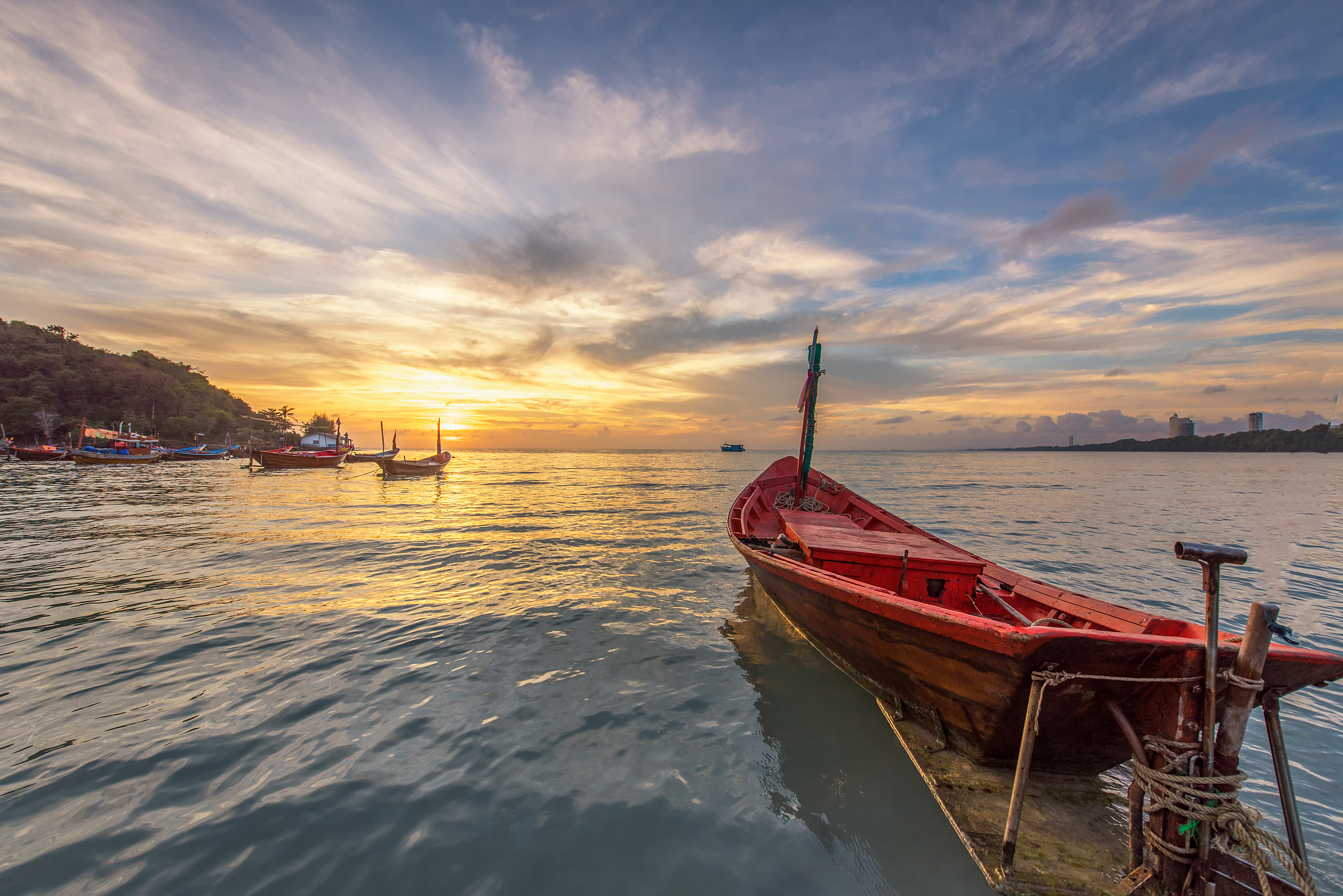 fisherman boat at beach sunset
