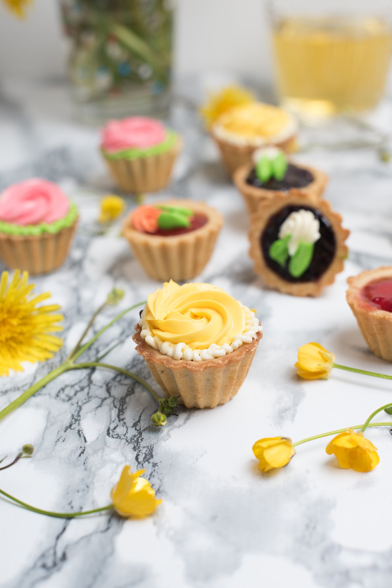 colorful cupcakes on grey marble table