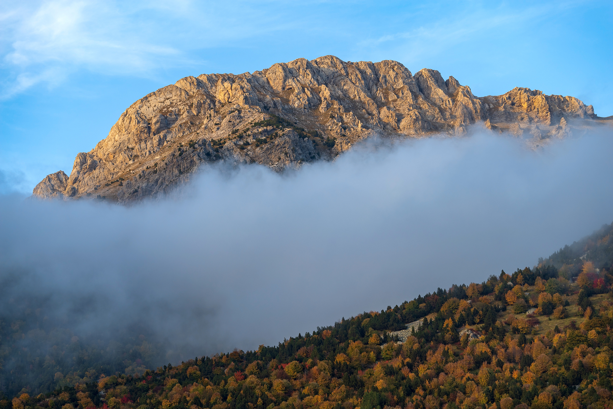 fog revealing mountain, italy
